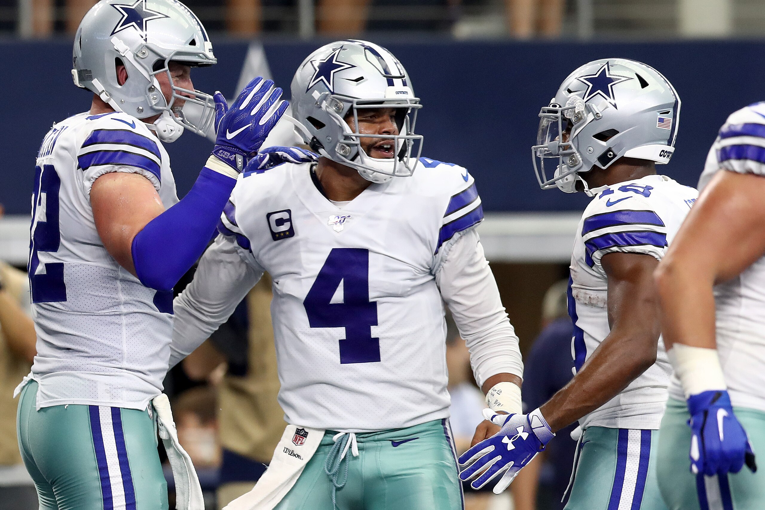 ARLINGTON, TEXAS - SEPTEMBER 08: Quarterback Dak Prescott #4 of the Dallas Cowboys celebrates the touchdown by teammate tight end Jason Witten #82 (L) during the second quarter of the game against New York Giants at AT&T Stadium on September 08, 2019 in A ARLINGTON, TEXAS - SEPTEMBER 08: Quarterback Dak Prescott #4 of the Dallas Cowboys celebrates the touchdown by teammate tight end Jason Witten #82 (L) during the second quarter of the game against New York Giants at AT&T Stadium on September 08, 2019 in A