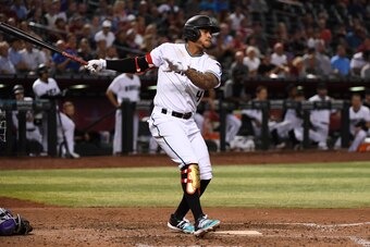 PHOENIX, ARIZONA - AUGUST 20: Ketel Marte #4 of the Arizona Diamondbacks follows through on a swing against the Colorado Rockies at Chase Field on August 20, 2019 in Phoenix, Arizona. (Photo by Norm Hall/Getty Images)