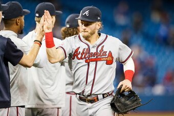 TORONTO, ONTARIO - AUGUST 28: Josh Donaldson #20 of the Atlanta Braves celebrates defeating the Toronto Blue Jays in the ninth inning during their MLB game at the Rogers Centre on August 28, 2019 in Toronto, Canada. (Photo by Mark Blinch/Getty Images)