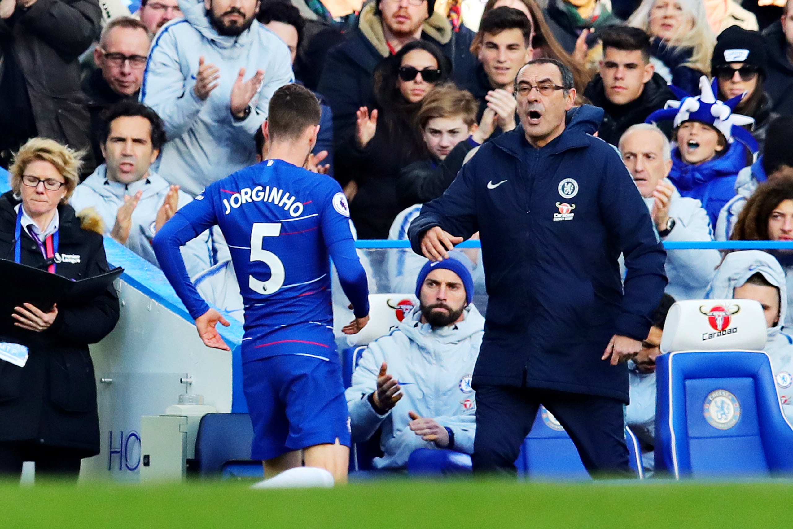LONDON, ENGLAND - MARCH 10: Jorginho of Chelsea talks with Chelsea manager Maurizio Sarri after being substituted during the Premier League match between Chelsea FC and Wolverhampton Wanderers at Stamford Bridge on March 10, 2019 in London, United Kingdom LONDON, ENGLAND - MARCH 10: Jorginho of Chelsea talks with Chelsea manager Maurizio Sarri after being substituted during the Premier League match between Chelsea FC and Wolverhampton Wanderers at Stamford Bridge on March 10, 2019 in London, United Kingdom