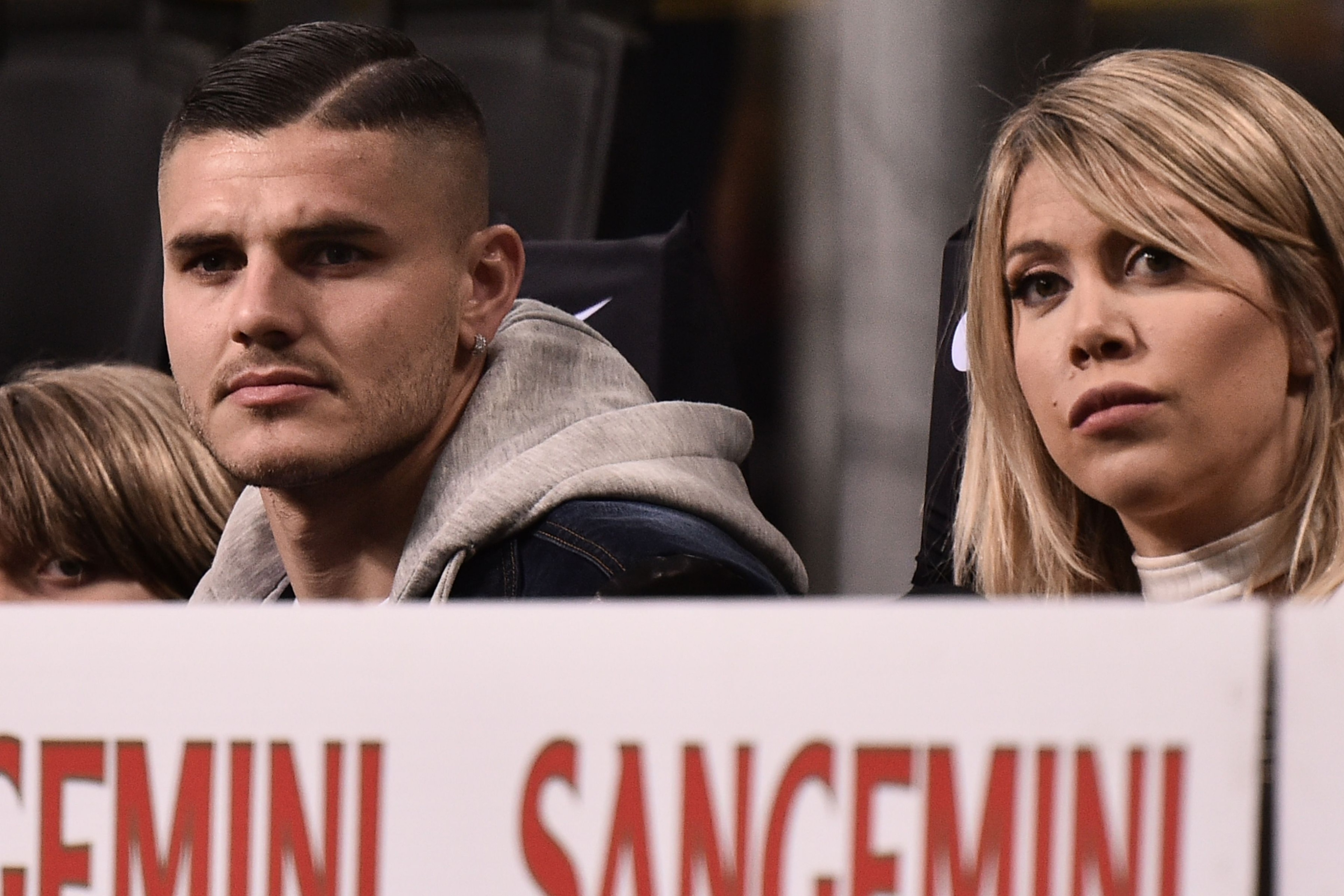 Inter Milan's Argentine forward Mauro Icardi (L) and his wife Argentine television personality, and football agent, Wanda Nara attend the Italian Serie A football match Inter Milan vs Lazio Rome on March 31, 2019 at the San Siro stadium in Milan. (Photo b Inter Milan's Argentine forward Mauro Icardi (L) and his wife Argentine television personality, and football agent, Wanda Nara attend the Italian Serie A football match Inter Milan vs Lazio Rome on March 31, 2019 at the San Siro stadium in Milan. (Photo b