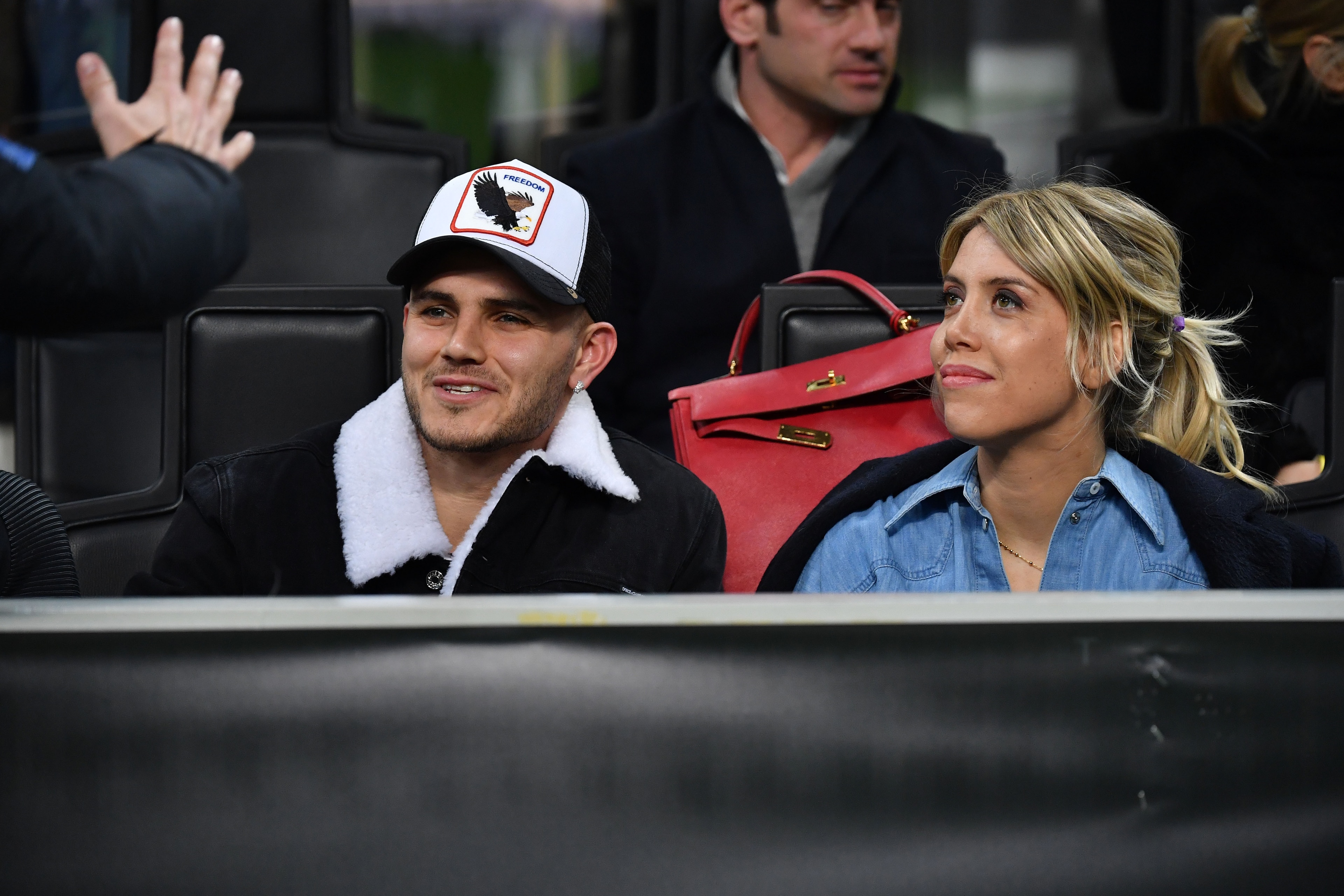 MILAN, ITALY - FEBRUARY 21: Mauro Icardi (L) and Wanda Nara look on in VIP standing during the UEFA Europa League Round of 32 Second Leg match between FC Internazionale and SK Rapid Wien at San Siro on February 21, 2019 in Milan, Italy. (Photo by Tullio P MILAN, ITALY - FEBRUARY 21: Mauro Icardi (L) and Wanda Nara look on in VIP standing during the UEFA Europa League Round of 32 Second Leg match between FC Internazionale and SK Rapid Wien at San Siro on February 21, 2019 in Milan, Italy. (Photo by Tullio P