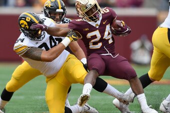 MINNEAPOLIS, MN - OCTOBER 06: A.J. Epenesa #94 of the Iowa Hawkeyes tackles Mohamed Ibrahim #24 of the Minnesota Golden Gophers during the first quarter of the game on October 6, 2018 at TCF Bank Stadium in Minneapolis, Minnesota. (Photo by Hannah Foslien