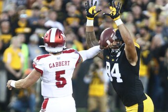 IOWA CITY, IOWA - AUGUST 31: Defensive end A.J. Epenesa #94 of the Iowa Hawkeyes puts pressure in the first half on quaterback Brett Gabbert #5 of the Miami Ohio RedHawks on August 31, 2019 at Kinnick Stadium in Iowa City, Iowa. (Photo by Matthew Holst/Ge