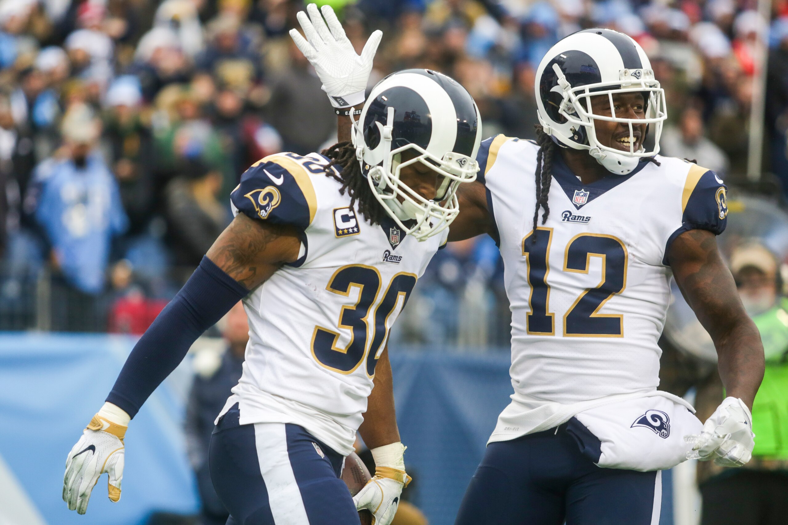 NASHVILLE, TN - DECEMBER 24: Running Back Todd Gurley II  #30 and Wide Receiver Sammy Watkins  #12 of the Los Angeles Rams celebrate after scoring a touchdown against the Tennessee Titans at Nissan Stadium on December 24, 2017 in Nashville, Tennessee. (Ph