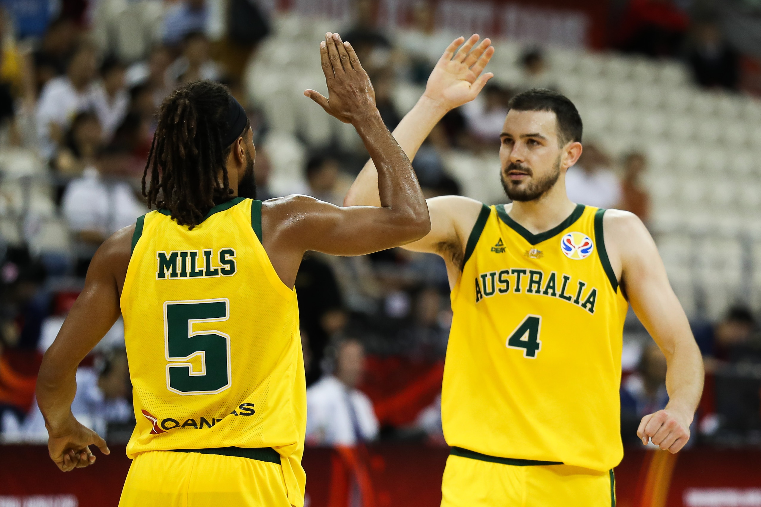 SHANGHAI, CHINA - SEPTEMBER 11: Patty Mills of Australia celebrates with teammate #4 Chris Goulding during the quarter final match between Australia and Czech Republic of 2019 FIBA World Cup at Shanghai Oriental Sports Center on September 11, 2019 in Shan SHANGHAI, CHINA - SEPTEMBER 11: Patty Mills of Australia celebrates with teammate #4 Chris Goulding during the quarter final match between Australia and Czech Republic of 2019 FIBA World Cup at Shanghai Oriental Sports Center on September 11, 2019 in Shan