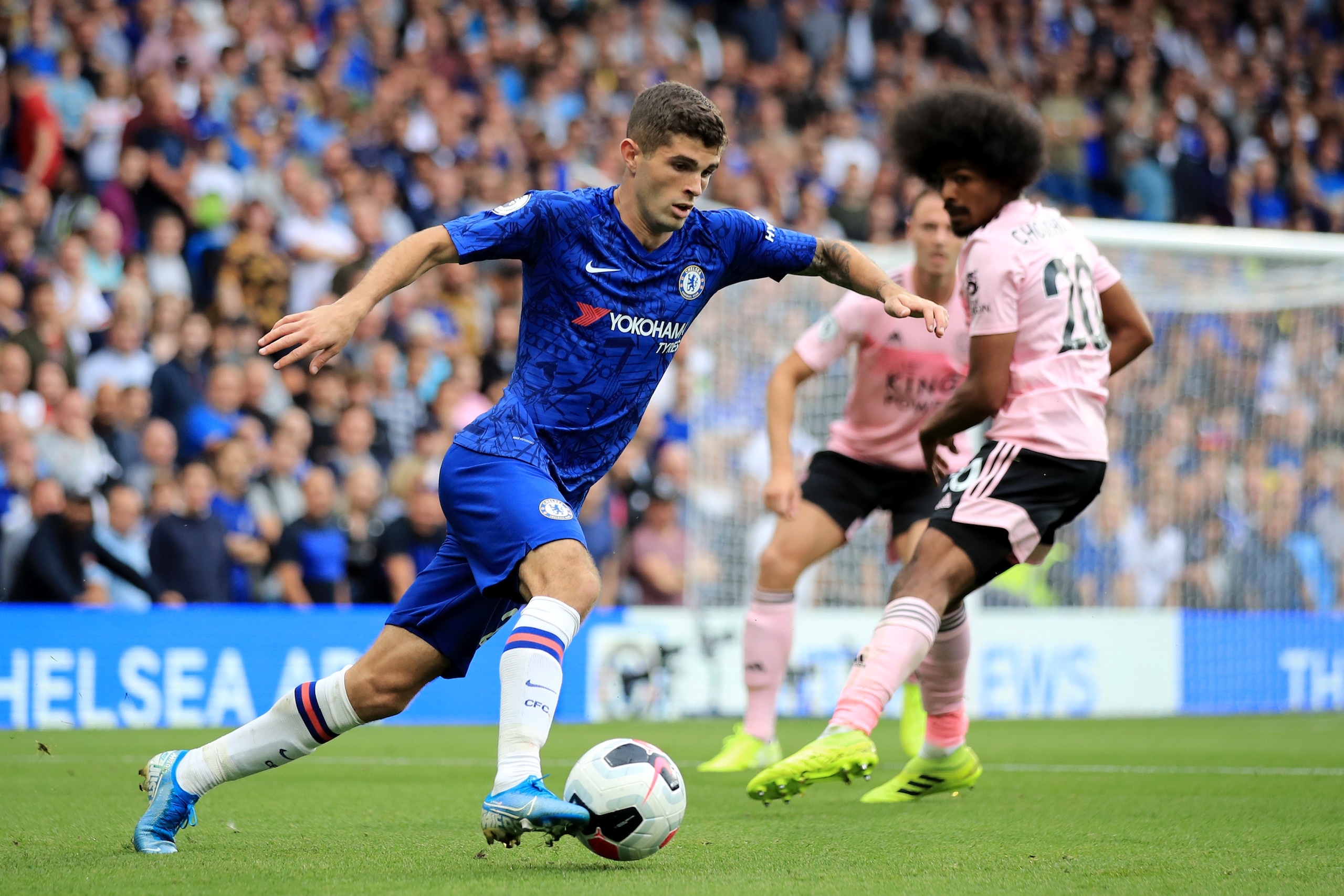 LONDON, ENGLAND - AUGUST 18: Christian Pulisic of Chelsea in action with Hamza Choudhury of Leicester City during the Premier League match between Chelsea FC and Leicester City at Stamford Bridge on August 18, 2019 in London, United Kingdom. (Photo by Mar