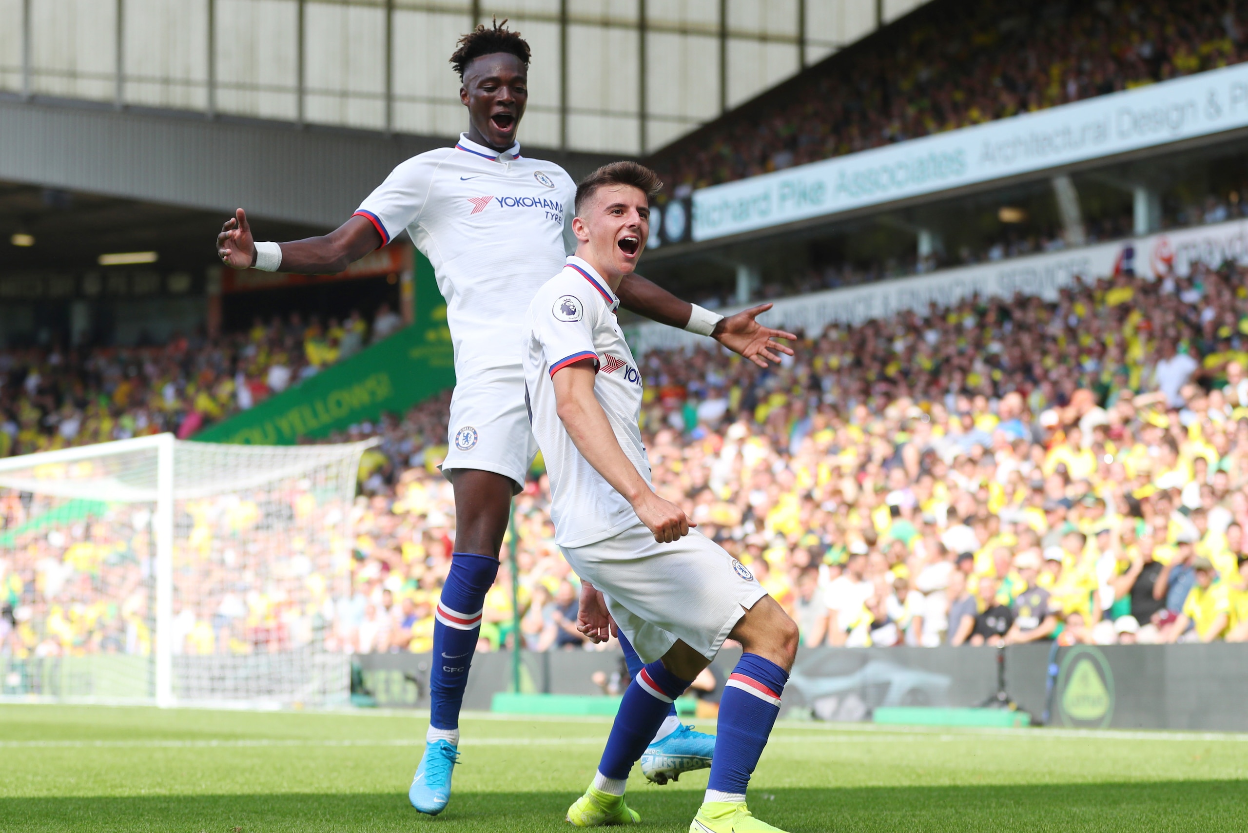 NORWICH, ENGLAND - AUGUST 24: Mason Mount of Chelsea celebrates scoring his teams second goal with Tammy Abraham during the Premier League match between Norwich City and Chelsea FC at Carrow Road on August 24, 2019 in Norwich, United Kingdom. (Photo by Ca