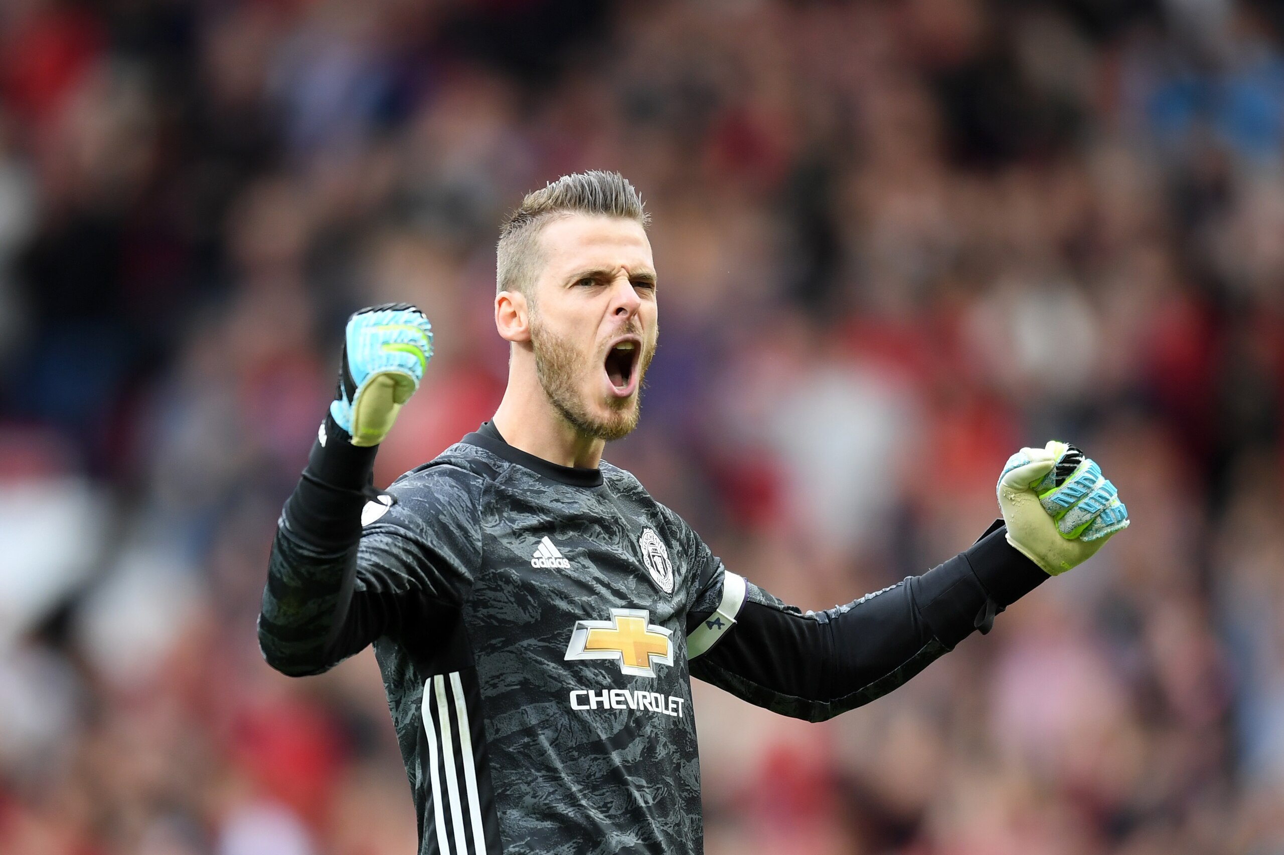 MANCHESTER, ENGLAND - AUGUST 11: David De Gea of Manchester United celebrates after his teammate Marcus Rashford of Manchester United scored their teams third goal during the Premier League match between Manchester United and Chelsea FC at Old Trafford on