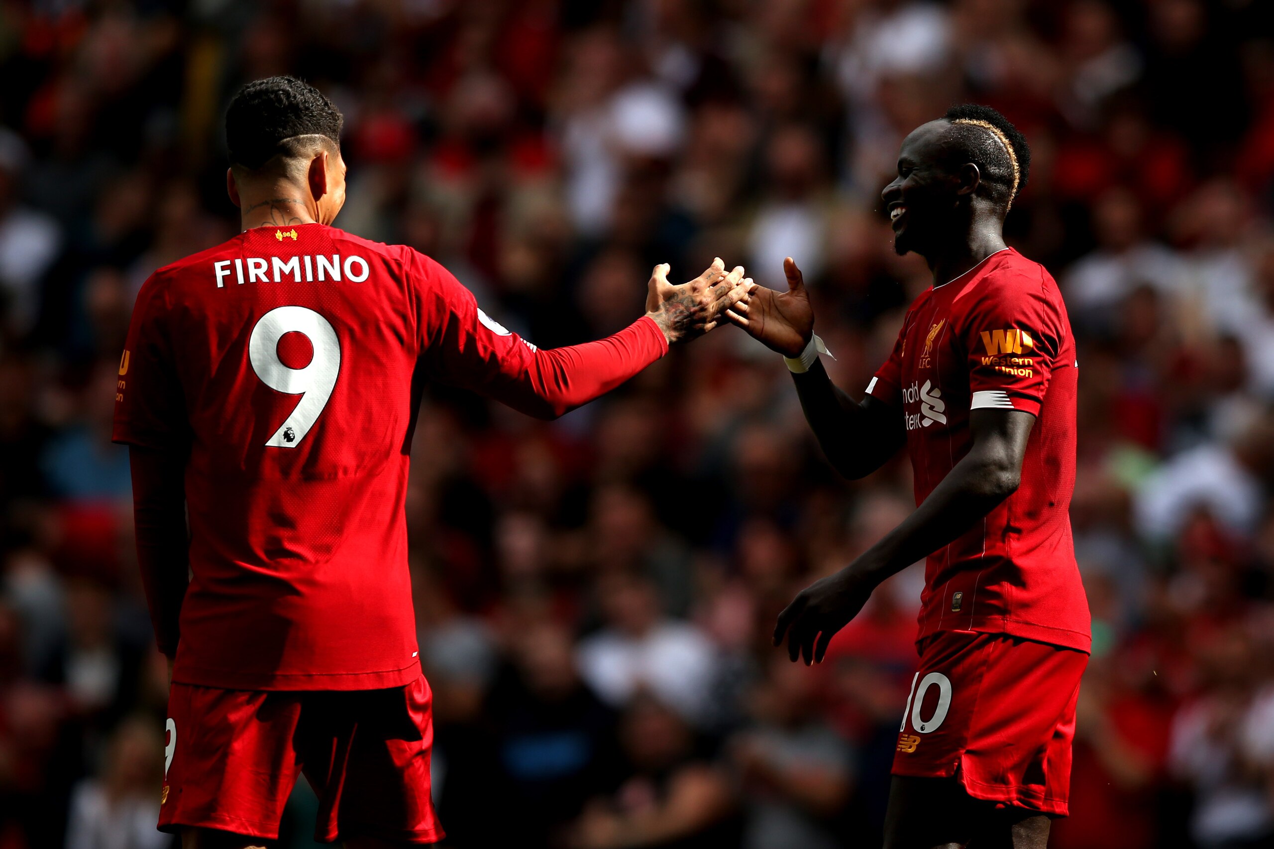 LIVERPOOL, ENGLAND - SEPTEMBER 14: Sadio Mane of Liverpool celebrates with Roberto Firmino after he scores his team's second goal during the Premier League match between Liverpool FC and Newcastle United at Anfield on September 14, 2019 in Liverpool, Unit LIVERPOOL, ENGLAND - SEPTEMBER 14: Sadio Mane of Liverpool celebrates with Roberto Firmino after he scores his team's second goal during the Premier League match between Liverpool FC and Newcastle United at Anfield on September 14, 2019 in Liverpool, Unit