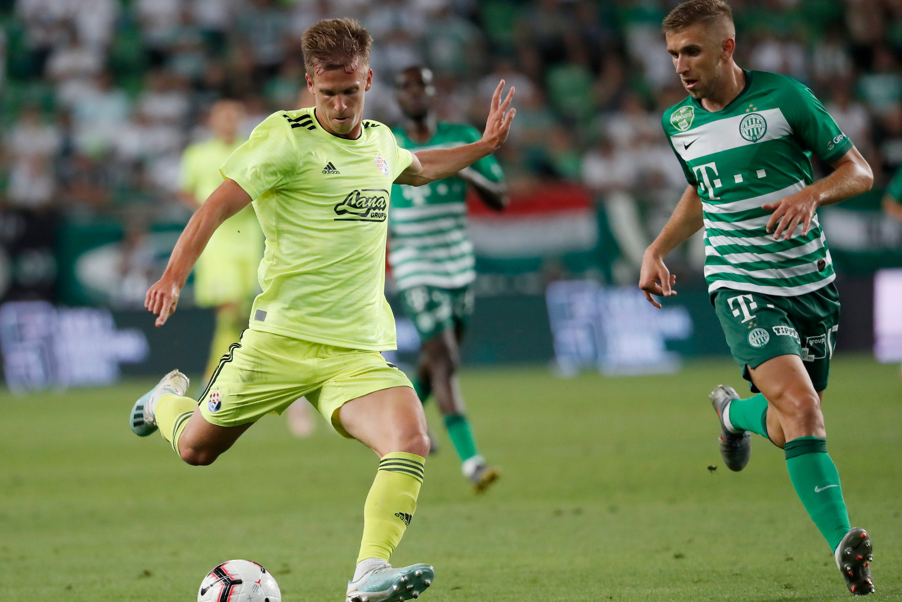 BUDAPEST, HUNGARY - AUGUST 13: (l-r) Dani Olmo of GNK Dinamo Zagreb shoots on goal next to Eldar Civic of Ferencvarosi TC during the UEFA Champions League Third Qualifying Round match between Ferencvarosi TC and GNK Dinamo Zagreb at Ferencvaros Stadium on BUDAPEST, HUNGARY - AUGUST 13: (l-r) Dani Olmo of GNK Dinamo Zagreb shoots on goal next to Eldar Civic of Ferencvarosi TC during the UEFA Champions League Third Qualifying Round match between Ferencvarosi TC and GNK Dinamo Zagreb at Ferencvaros Stadium on