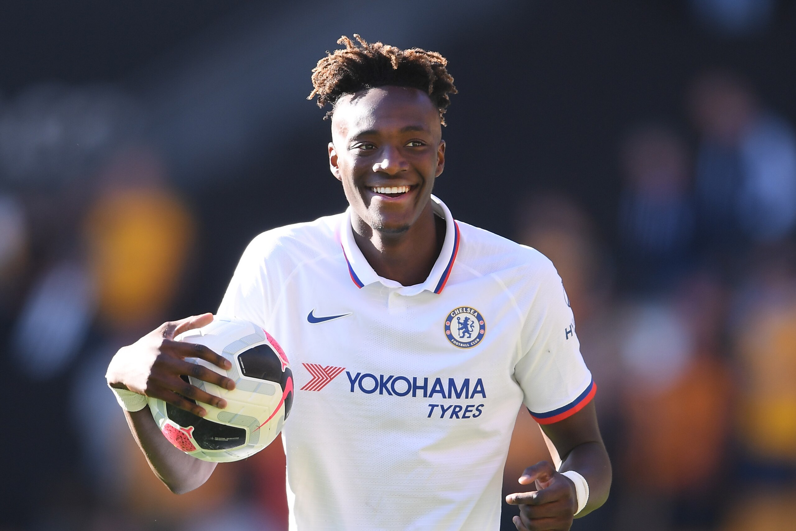 WOLVERHAMPTON, ENGLAND - SEPTEMBER 14: Tammy Abraham of Chelsea holds the match ball after scoring a hat trick during the Premier League match between Wolverhampton Wanderers and Chelsea FC at Molineux on September 14, 2019 in Wolverhampton, United Kingdo WOLVERHAMPTON, ENGLAND - SEPTEMBER 14: Tammy Abraham of Chelsea holds the match ball after scoring a hat trick during the Premier League match between Wolverhampton Wanderers and Chelsea FC at Molineux on September 14, 2019 in Wolverhampton, United Kingdo