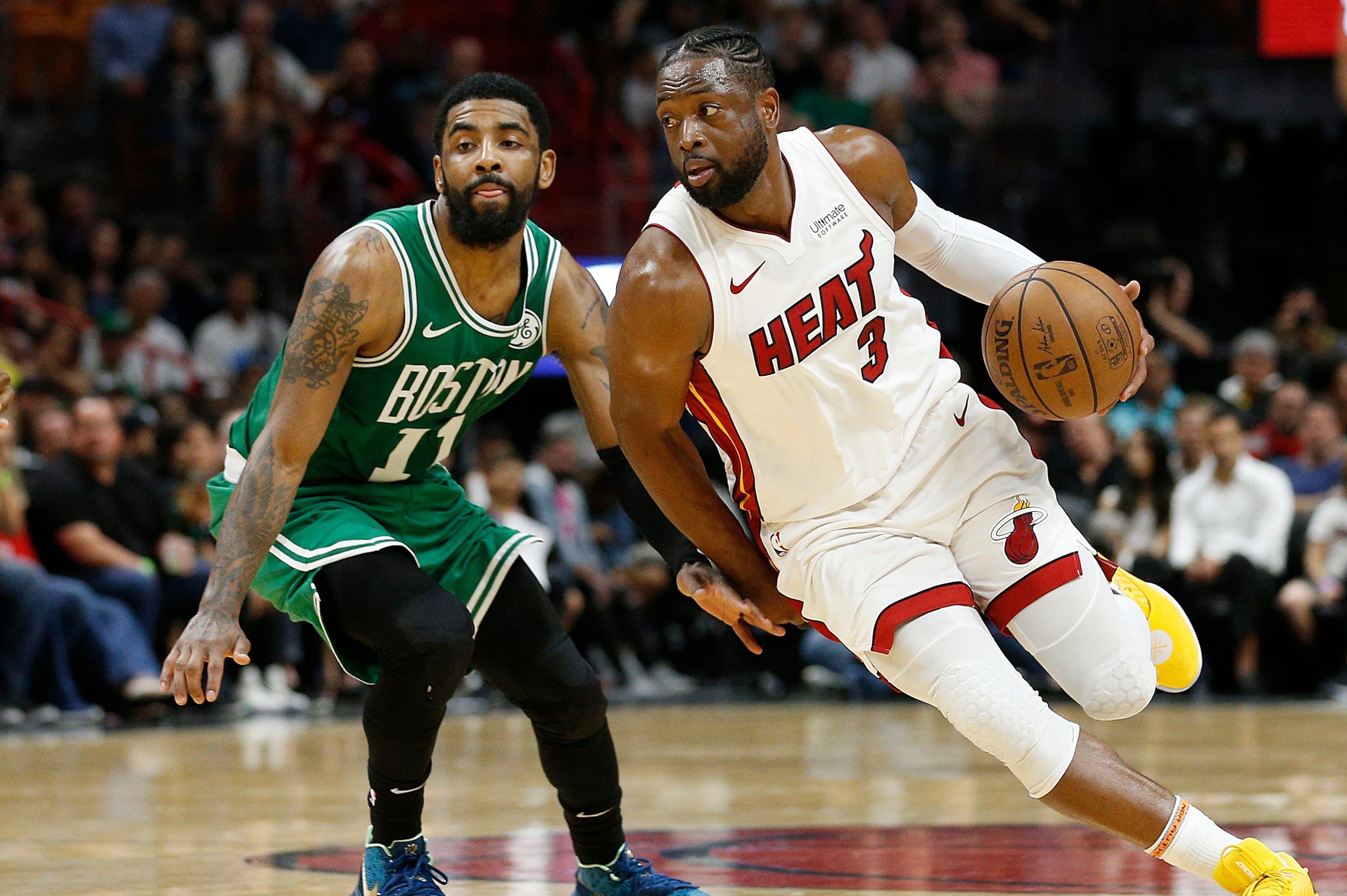 MIAMI, FLORIDA - APRIL 03: Dwyane Wade #3 of the Miami Heat drives to the basket against Kyrie Irving #11 of the Boston Celtics at American Airlines Arena on April 03, 2019 in Miami, Florida. NOTE TO USER: User expressly acknowledges and agrees that, by MIAMI, FLORIDA - APRIL 03: Dwyane Wade #3 of the Miami Heat drives to the basket against Kyrie Irving #11 of the Boston Celtics at American Airlines Arena on April 03, 2019 in Miami, Florida. NOTE TO USER: User expressly acknowledges and agrees that, by