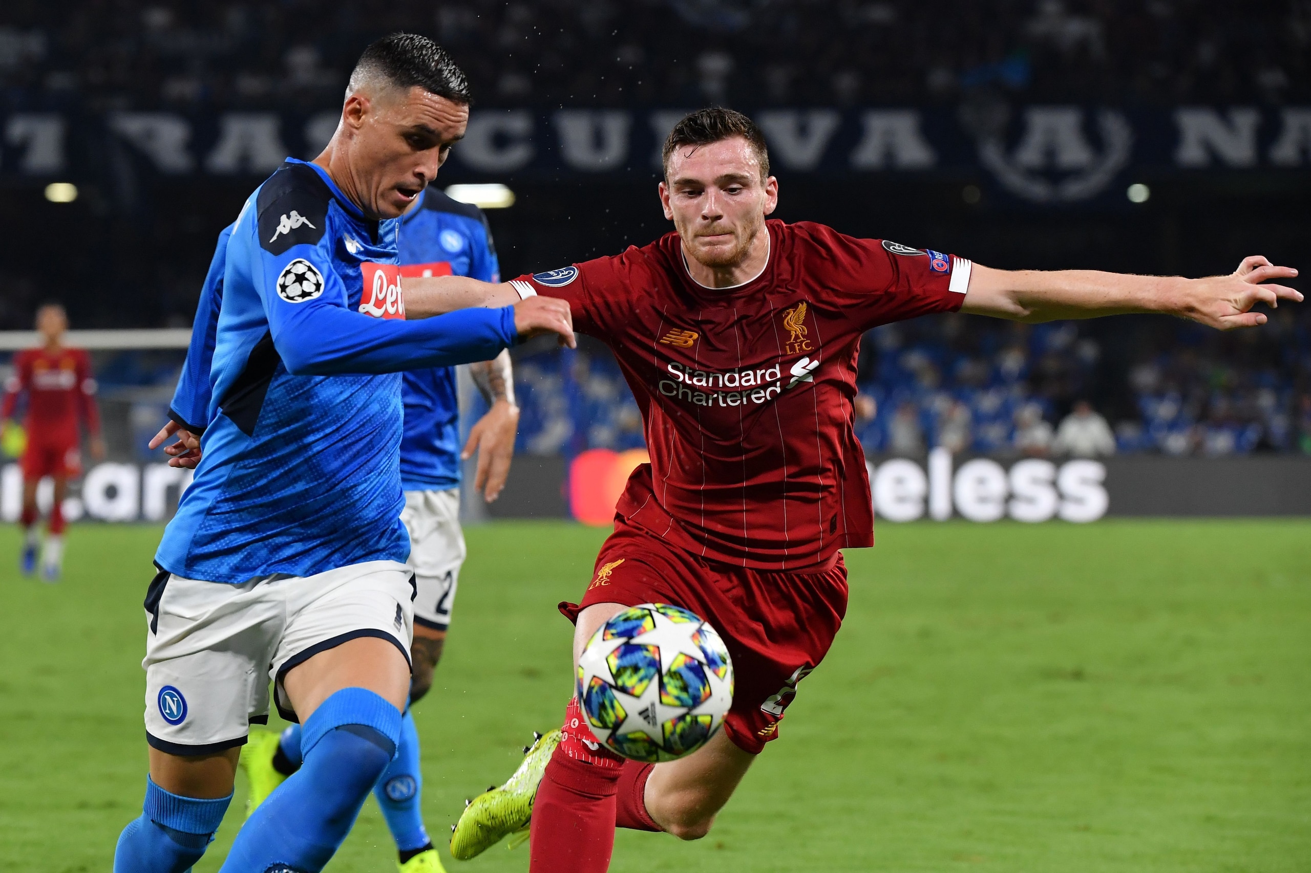 Napoli's Spanish forward Jose Callejon (L) challenges Liverpool's Scottish defender Andrew Robertson during the UEFA Champions League Group E football match Napoli vs Liverpool on September 17, 2019 at the San Paolo stadium in Naples. (Photo by Andreas SO