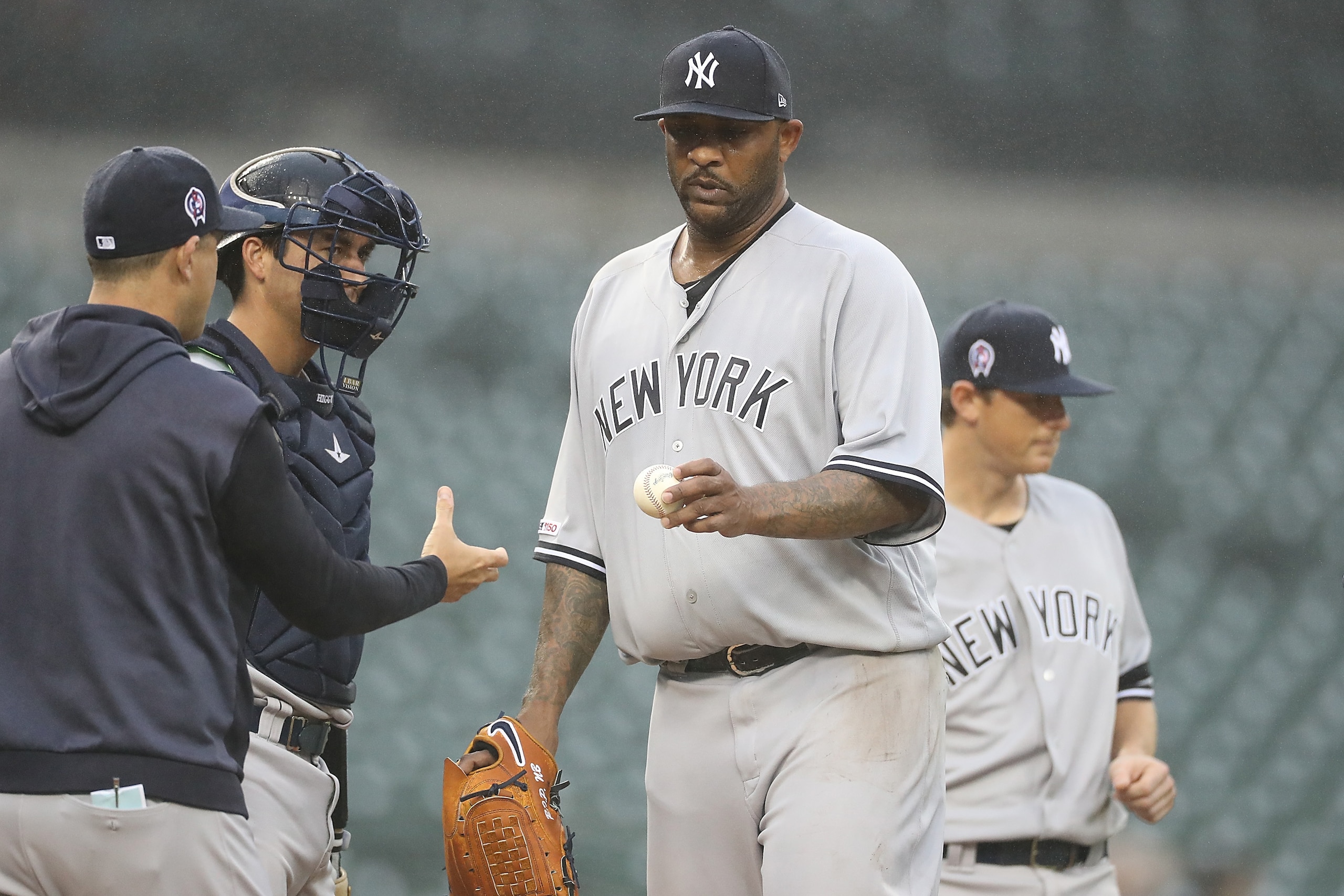 DETROIT, MI - SEPTEMBER 12: Manager Aaron Boone #17 of the New York Yankee makes a pitching change removing pitcher CC Sabathia #52 during the fourth inning of game two of the doubleheader against the Detroit Tigers at Comerica Park on September 12, 2019 DETROIT, MI - SEPTEMBER 12: Manager Aaron Boone #17 of the New York Yankee makes a pitching change removing pitcher CC Sabathia #52 during the fourth inning of game two of the doubleheader against the Detroit Tigers at Comerica Park on September 12, 2019