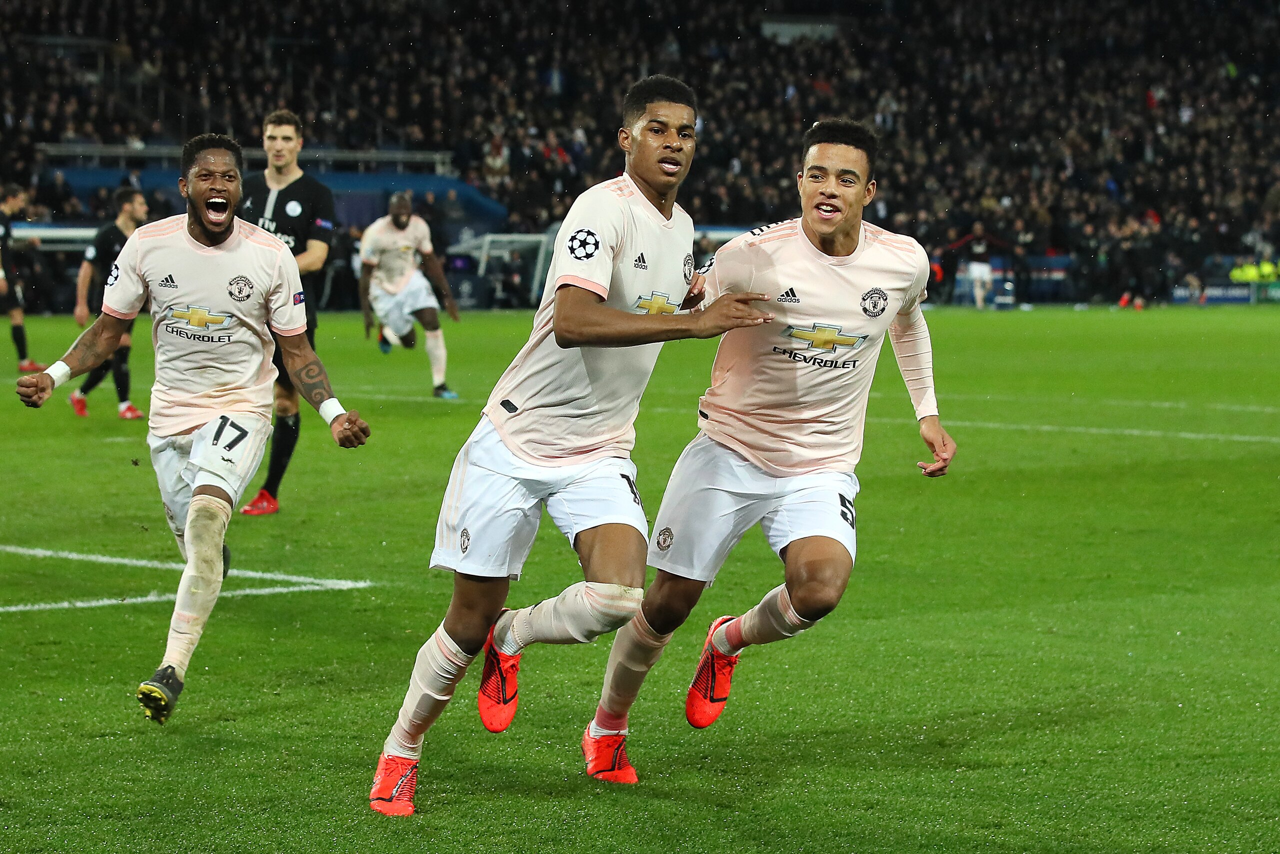 PARIS, FRANCE - MARCH 06:  Marcus Rashford of Manchester United celebrates scoring a goal to make the score 1-3 with Mason Greenwood during the UEFA Champions League Round of 16 Second Leg match between Paris Saint-Germain and Manchester United at Parc de