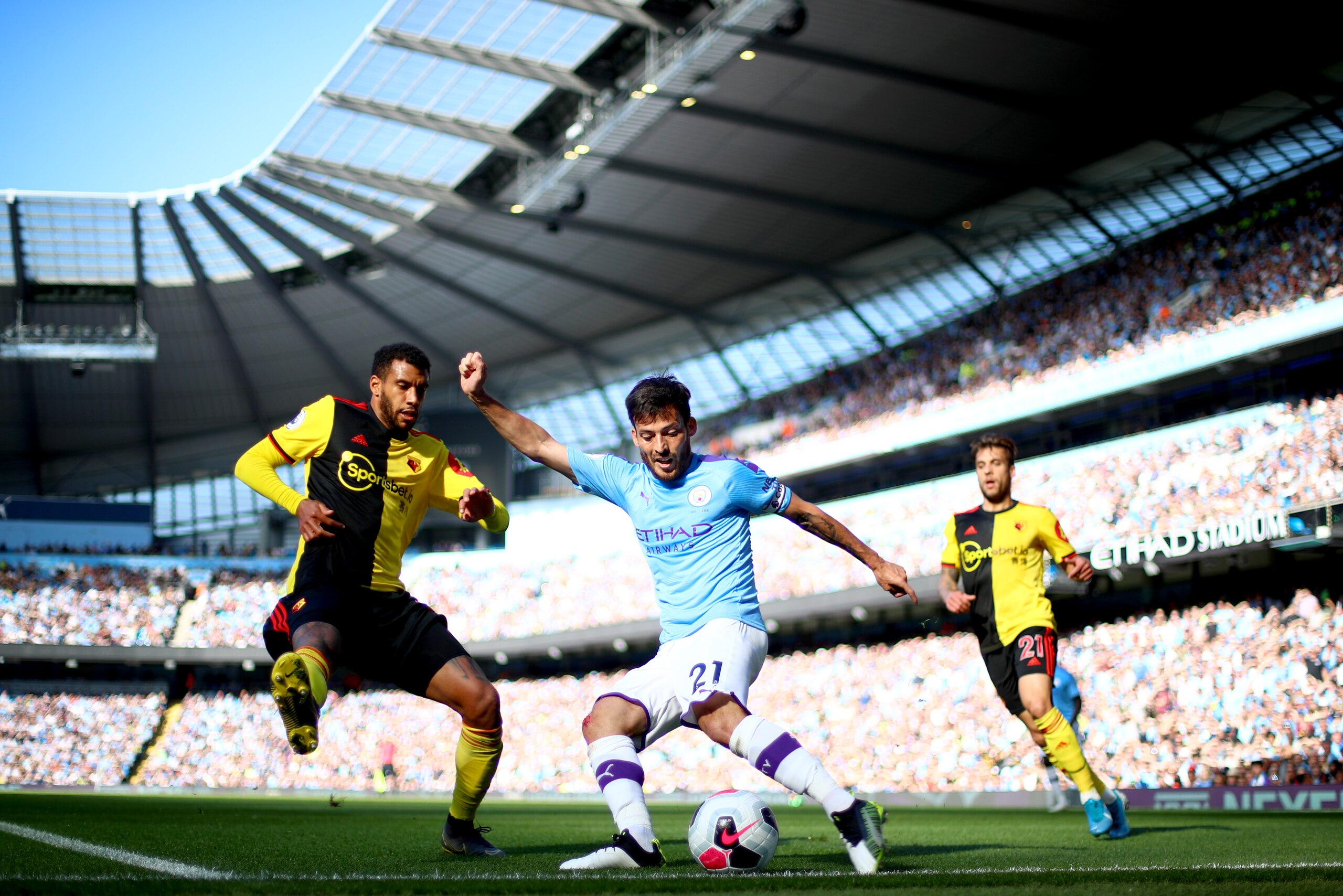 MANCHESTER, ENGLAND - SEPTEMBER 21: David Silva of Manchester City crosses the ball during the Premier League match between Manchester City and Watford FC at Etihad Stadium on September 21, 2019 in Manchester, United Kingdom. (Photo by Chloe Knott - Daneh
