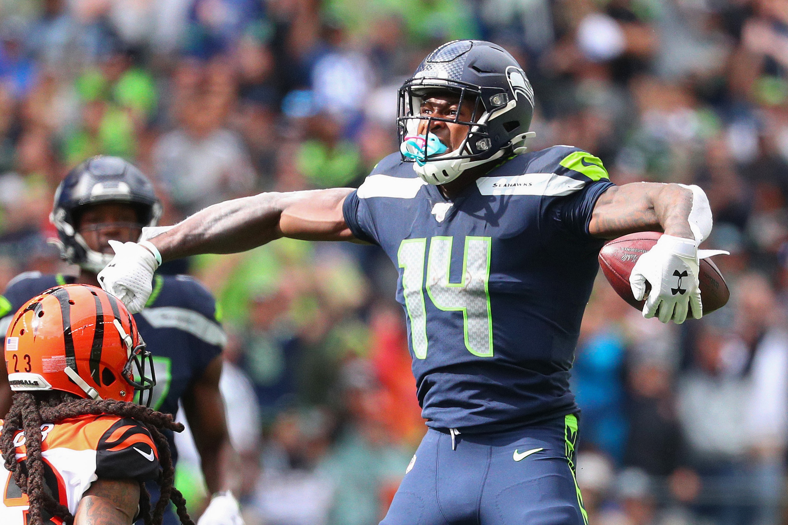 SEATTLE, WASHINGTON - SEPTEMBER 08: D.K. Metcalf #14 of the Seattle Seahawks celebrates after making a catch in the third quarter against the Cincinnati Bengals during their game at CenturyLink Field on September 08, 2019 in Seattle, Washington. (Photo by