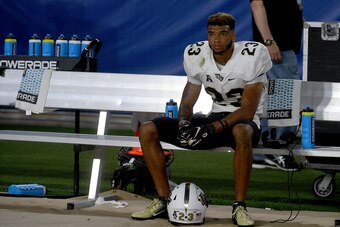 PITTSBURGH, PA - SEPTEMBER 21: Tay Gowan #23 of the UCF Knights sits on the bench following a 35-34 loss to the Pittsburgh Panthers at Heinz Field on September 21, 2019 in Pittsburgh, Pennsylvania. (Photo by Justin Berl/Getty Images)