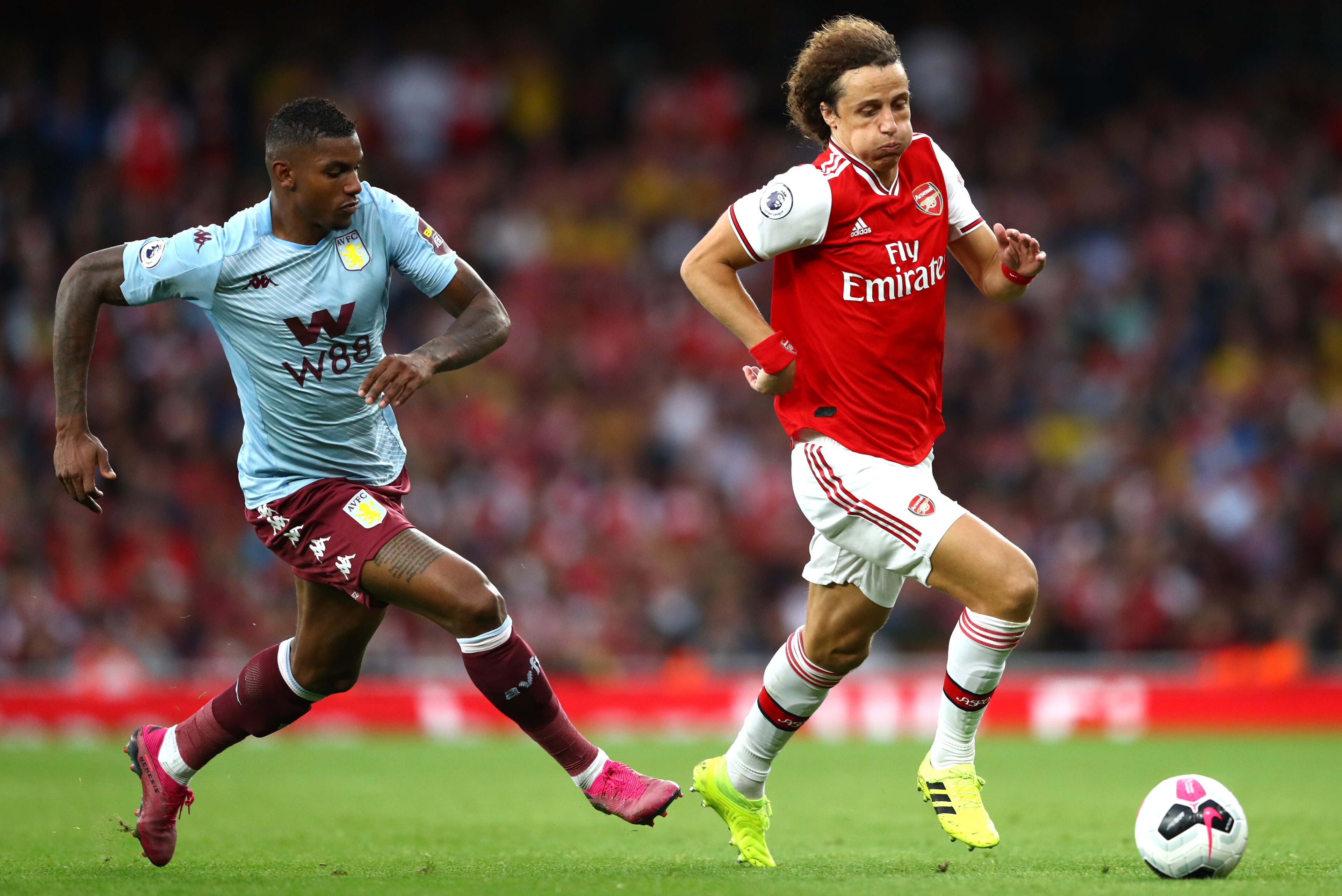 LONDON, ENGLAND - SEPTEMBER 22: David Luiz of Arsenal battles for possession with Wesley of Aston Villa during the Premier League match between Arsenal FC and Aston Villa at Emirates Stadium on September 22, 2019 in London, United Kingdom. (Photo by Micha