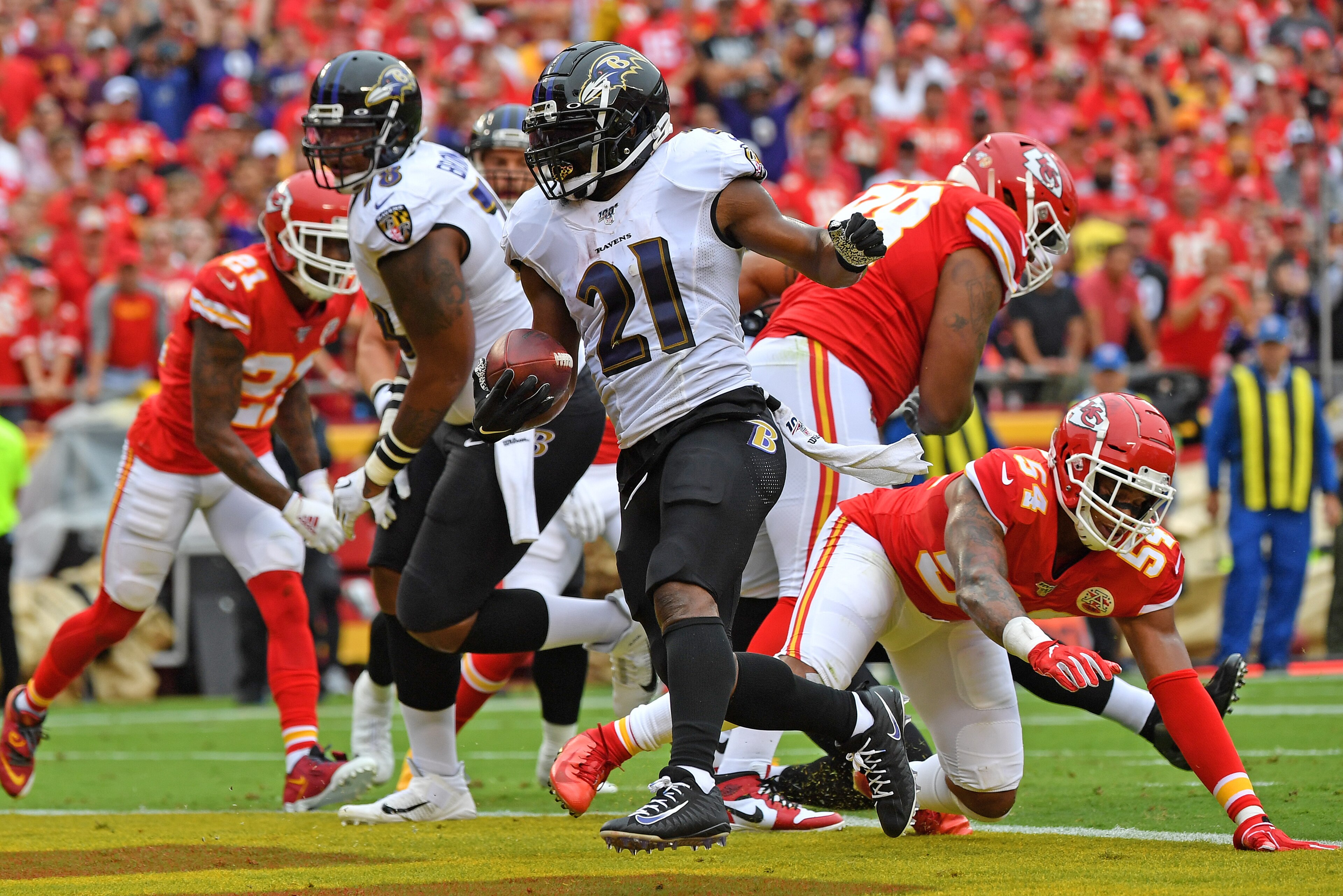 KANSAS CITY, MO - SEPTEMBER 22:  Running back Mark Ingram #21 of the Baltimore Ravens rushes into the end zone for a touchdown against the Kansas City Chiefs during the first half at Arrowhead Stadium on September 22, 2019 in Kansas City, Missouri. (Photo