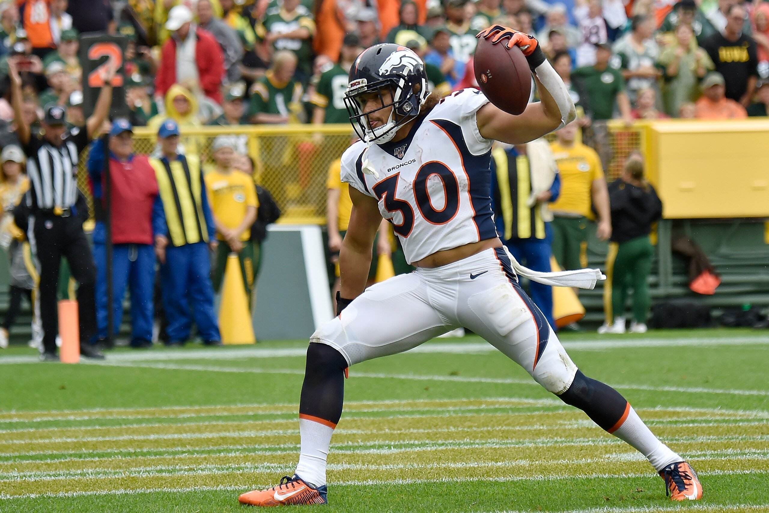GREEN BAY, WISCONSIN - SEPTEMBER 22: Phillip Lindsay #30 of the Denver Broncos celebrates after scoring a touchdown in the first quarter against the Green Bay Packers at Lambeau Field on September 22, 2019 in Green Bay, Wisconsin. (Photo by Quinn Harris/G