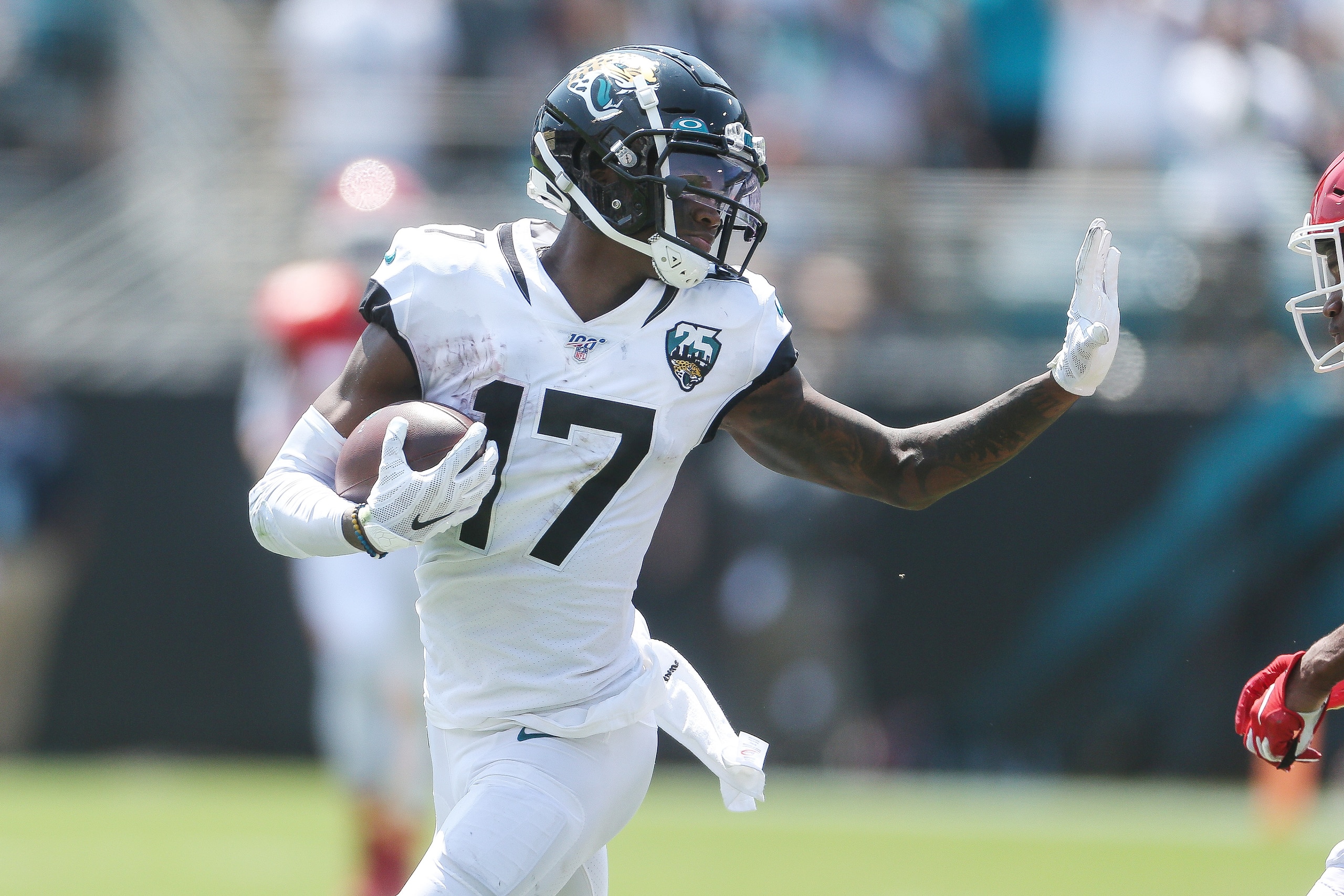JACKSONVILLE, FLORIDA - SEPTEMBER 08:   
DJ Chark Jr. of the Jacksonville Jaguars carries the ball after catching a pass against the Kansas City Chiefs during a NFL game at TIAA Bank Field on September 08, 2019 in Jacksonville, Florida.  (Photo by John Ca