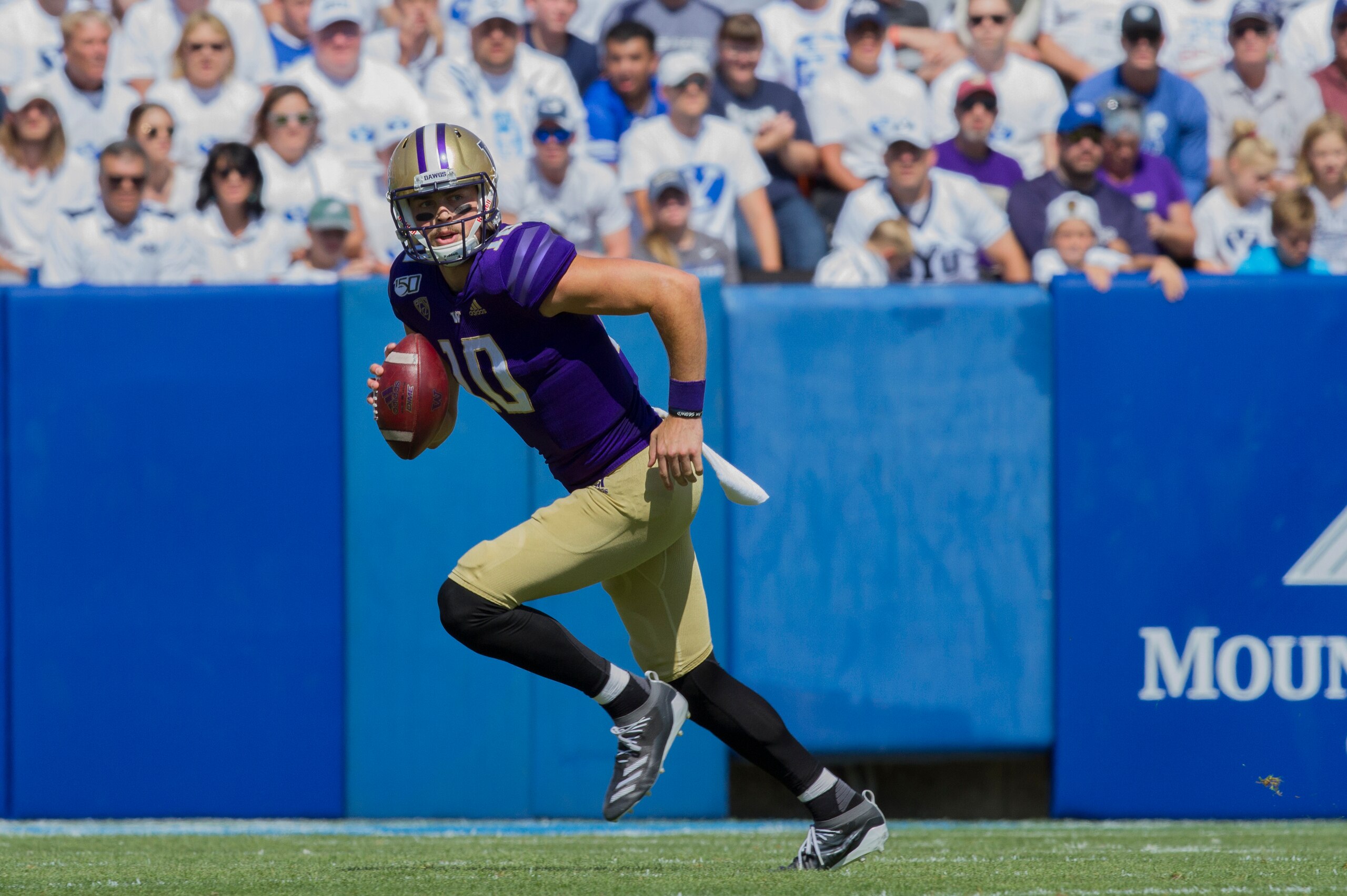 PROVO, UT - SEPTEMBER 21 : Jacob Eason #10 of the Washington Huskies rolls out of the pocket against the BYU Cougars at LaVell Edwards Stadium on September 21, 2019 in Provo, Utah. (Photo by Chris Gardner/Getty Images)