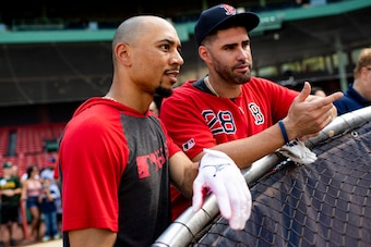 BOSTON, MA - JULY 28: Mookie Betts #50 talks with J.D. Martinez #28 of the Boston Red Sox before a game against the New York Yankees on July 28, 2019 at Fenway Park in Boston, Massachusetts. (Photo by Billie Weiss/Boston Red Sox/Getty Images)