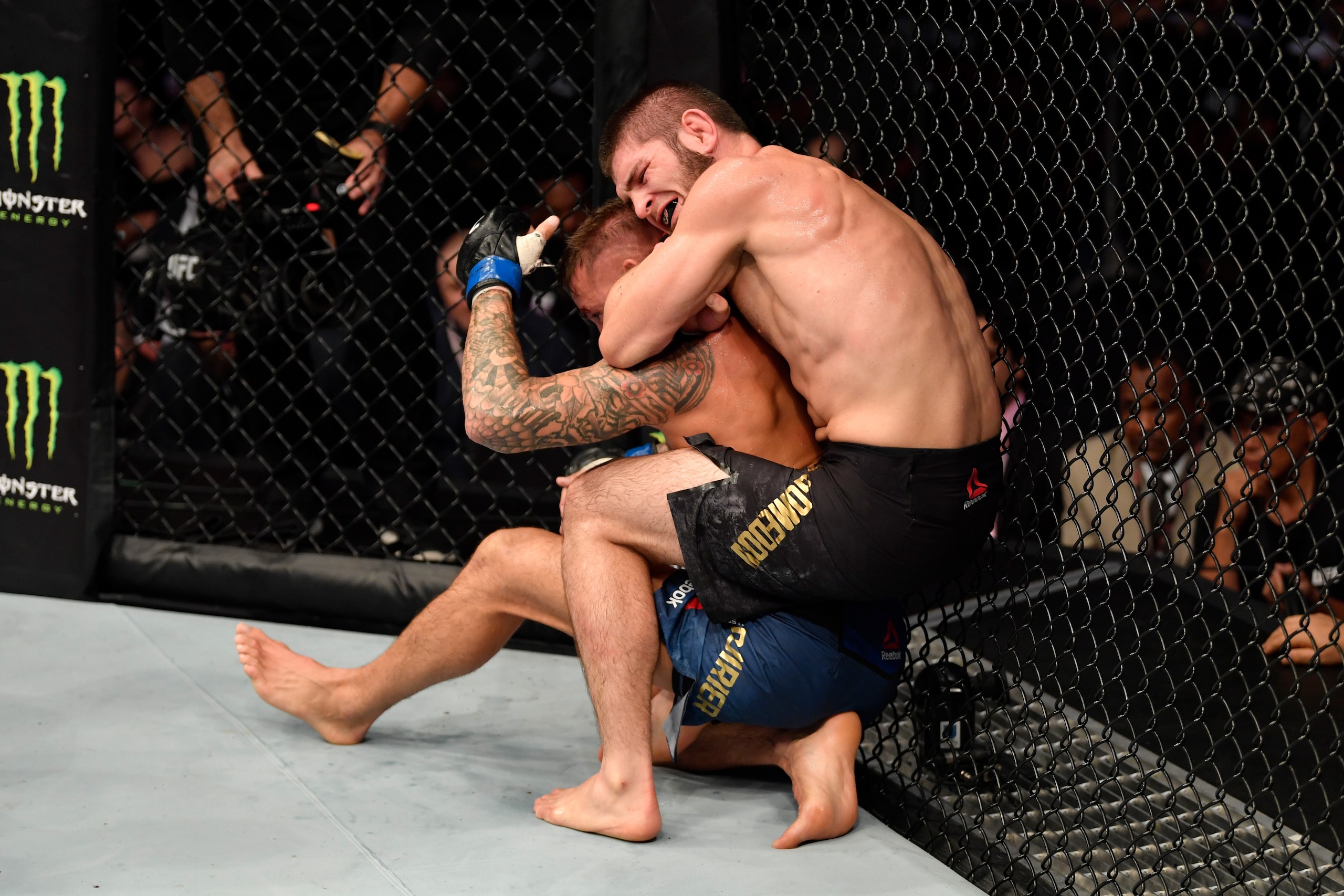 ABU DHABI, UNITED ARAB EMIRATES - SEPTEMBER 07: (R-L) Khabib Nurmagomedov of Russia submits Dustin Poirier in their lightweight championship bout during UFC 242 at The Arena on September 7, 2019 in Yas Island, Abu Dhabi, United Arab Emirates. (Photo by J ABU DHABI, UNITED ARAB EMIRATES - SEPTEMBER 07: (R-L) Khabib Nurmagomedov of Russia submits Dustin Poirier in their lightweight championship bout during UFC 242 at The Arena on September 7, 2019 in Yas Island, Abu Dhabi, United Arab Emirates. (Photo by J