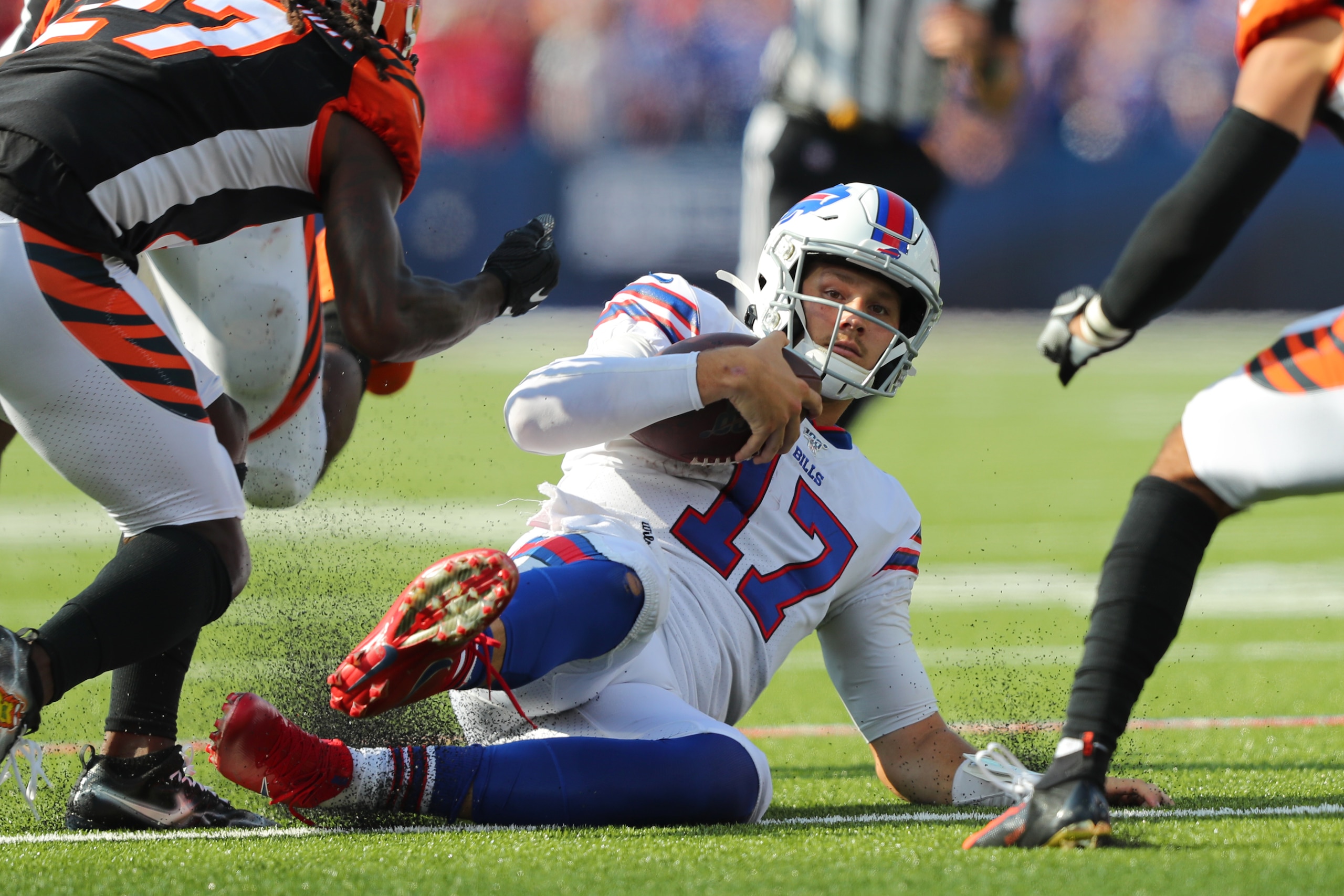ORCHARD PARK, NY - SEPTEMBER 22:  Dre Kirkpatrick #27 of the Cincinnati Bengals watches as Josh Allen #17 of the Buffalo Bills slides to the ground during the second half at New Era Field on September 22, 2019 in Orchard Park, New York. Buffalo beats Cinc
