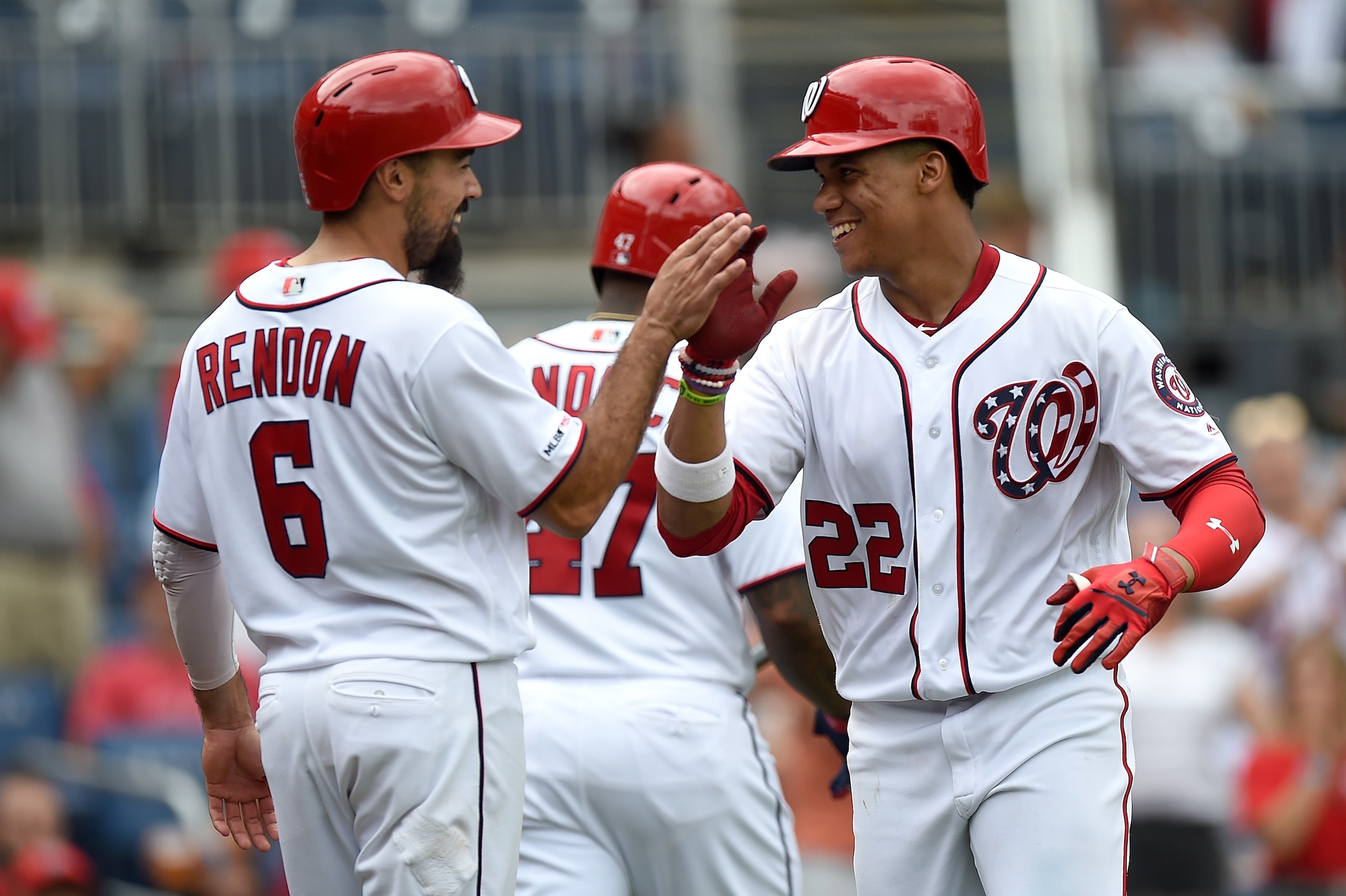WASHINGTON, DC - SEPTEMBER 01:  Juan Soto #22 of the Washington Nationals celebrates with Anthony Rendon #6 after hitting a two-run home run in the seventh inning against the Miami Marlins at Nationals Park on September 1, 2019 in Washington, DC.  (Photo 