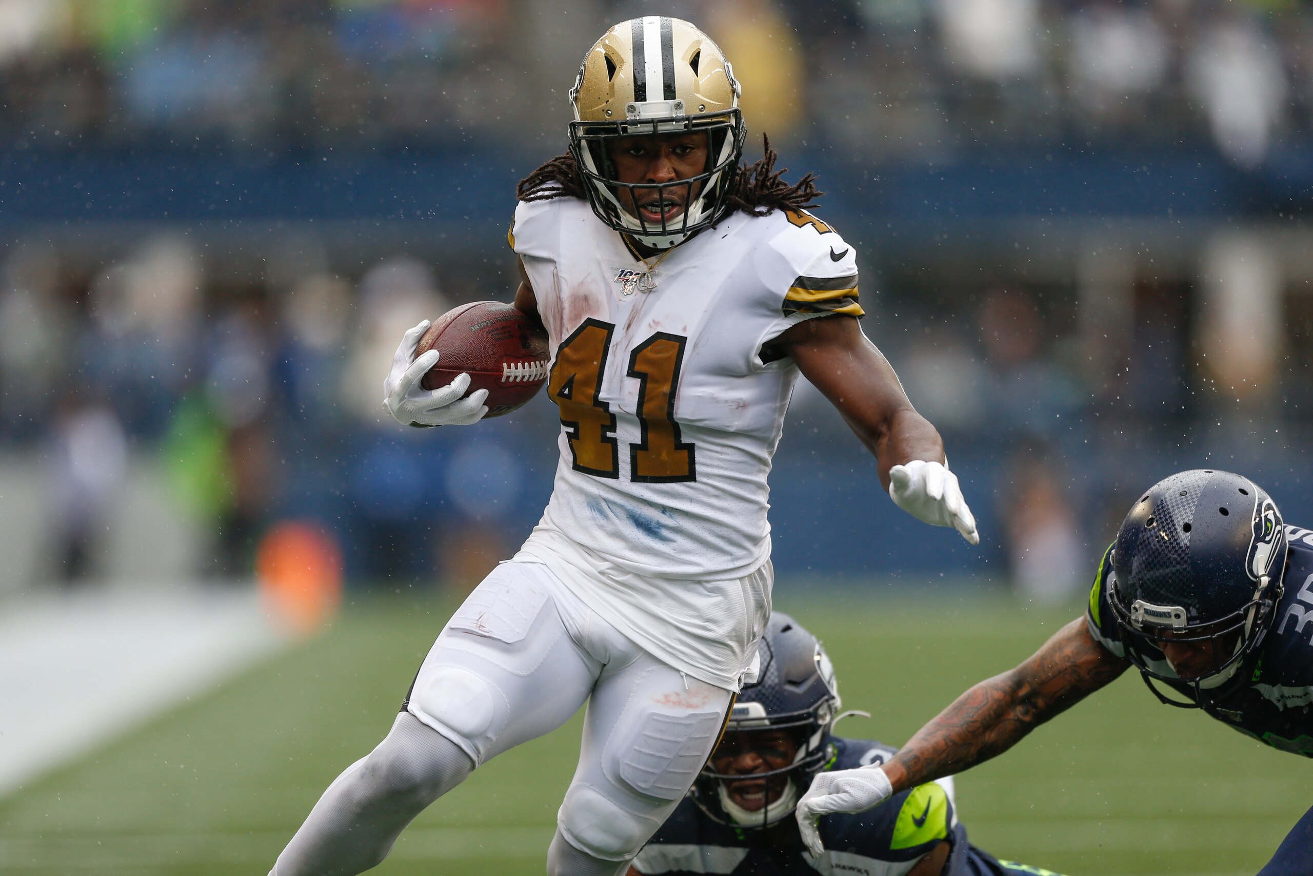 SEATTLE, WA - SEPTEMBER 22:  Running back Alvin Kamara #41 of the New Orleans Saints rushes for a touchdown in the second quarter against the Seattle Seahawks at CenturyLink Field on September 22, 2019 in Seattle, Washington.  (Photo by Otto Greule Jr/Get