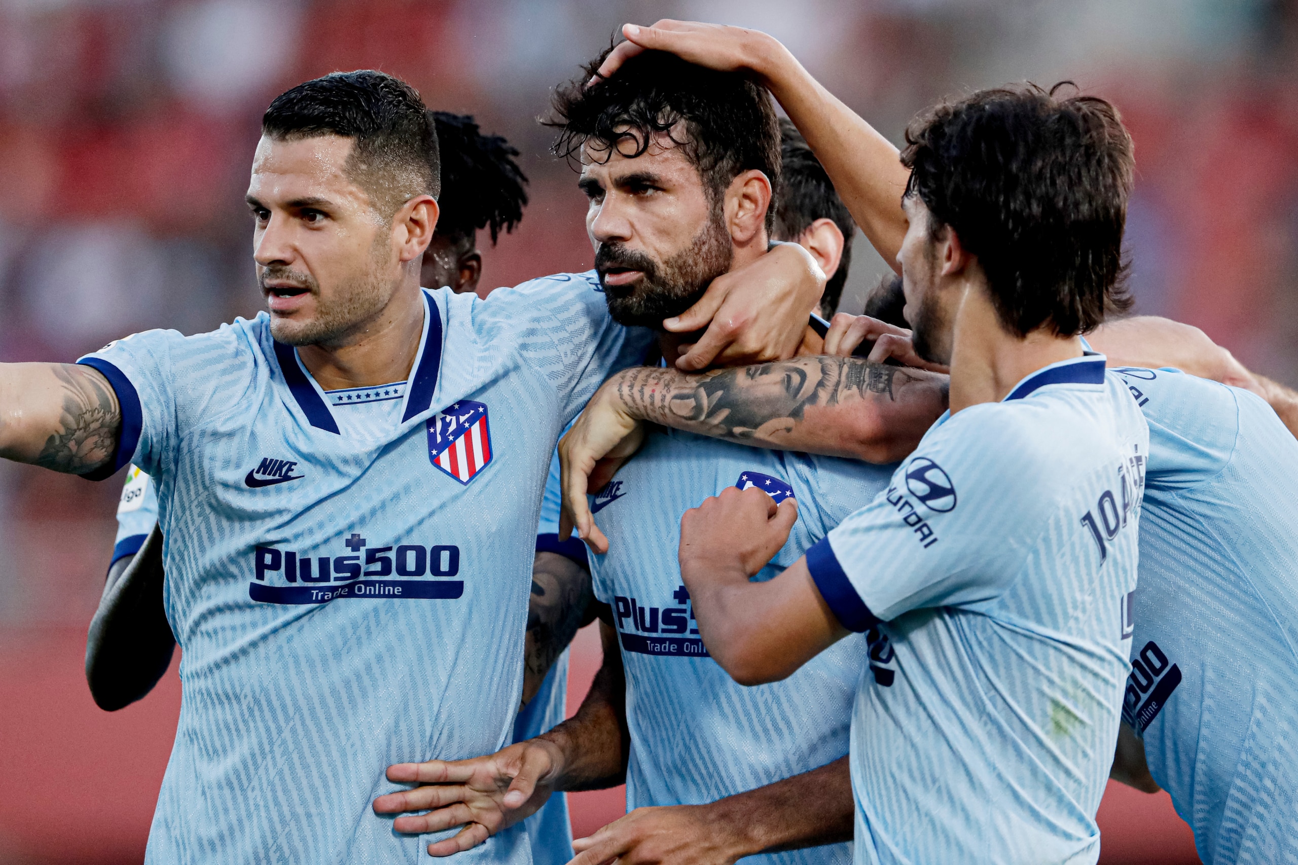 MALLORCA, SPAIN - SEPTEMBER 25: Diego Costa of Atletico Madrid celebrates 0-1 with Vitolo of Atletico Madrid, Joao Felix of Atletico Madrid  during the La Liga Santander  match between Real Mallorca v Atletico Madrid at the Iberostar Stadium on September 