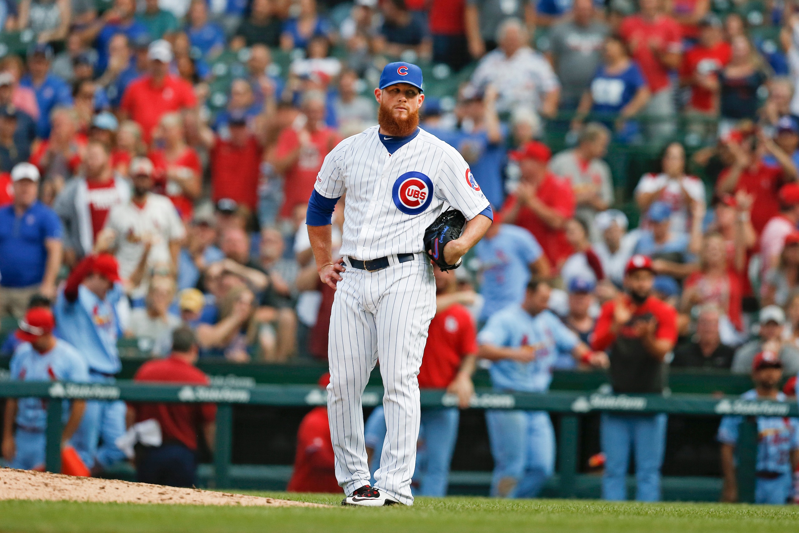 CHICAGO, ILLINOIS - SEPTEMBER 21: Craig Kimbrel #24 of the Chicago Cubs reacts after giving up a home run to Paul DeJong #12 of the St. Louis Cardinals during the ninth inning of a game at Wrigley Field on September 21, 2019 in Chicago, Illinois. (Photo b