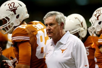 SAN ANTONIO, TX - DECEMBER 30: Head coach Mack Brown of the Texas Longhorns looks on against the Oregon Ducks during the Valero Alamo Bowl at the Alamodome on December 30, 2013 in San Antonio, Texas.  (Photo by Ronald Martinez/Getty Images)