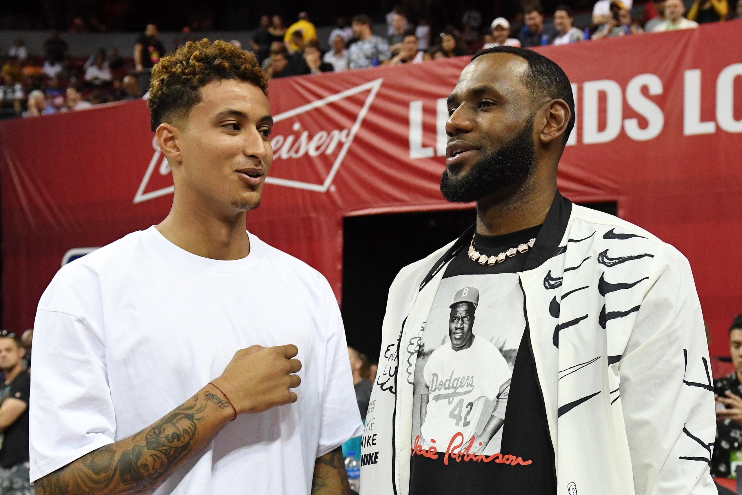 LAS VEGAS, NEVADA - JULY 06:  Kyle Kuzma (L) and LeBron James of the Los Angeles Lakers talk before a game between the Lakers and the LA Clippers during the 2019 NBA Summer League at the Thomas & Mack Center on July 6, 2019 in Las Vegas, Nevada. NOTE TO U