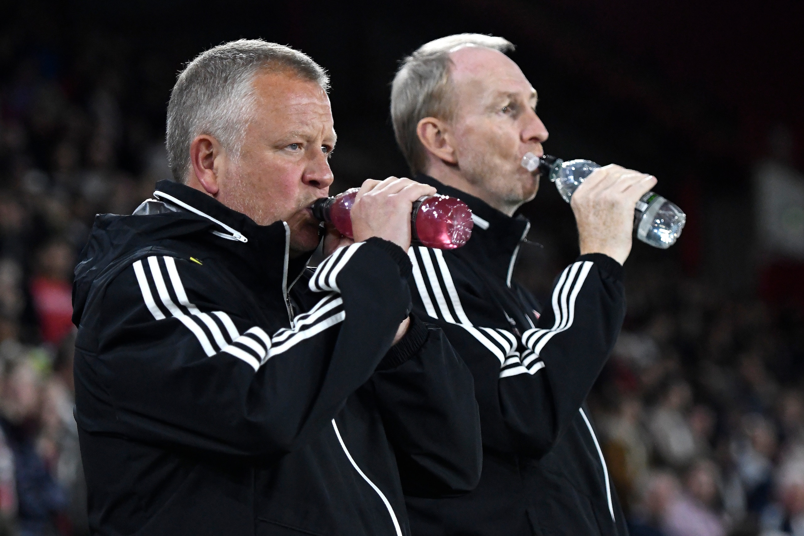 SHEFFIELD, ENGLAND - SEPTEMBER 25: Chris Wilder, Manager of Sheffield United and Alan Knill, Assistant Coach of Sheffield United take a drink prior to the Carabao Cup Third Round match between Sheffield United and Sunderland at Bramall Lane on September 2 SHEFFIELD, ENGLAND - SEPTEMBER 25: Chris Wilder, Manager of Sheffield United and Alan Knill, Assistant Coach of Sheffield United take a drink prior to the Carabao Cup Third Round match between Sheffield United and Sunderland at Bramall Lane on September 2