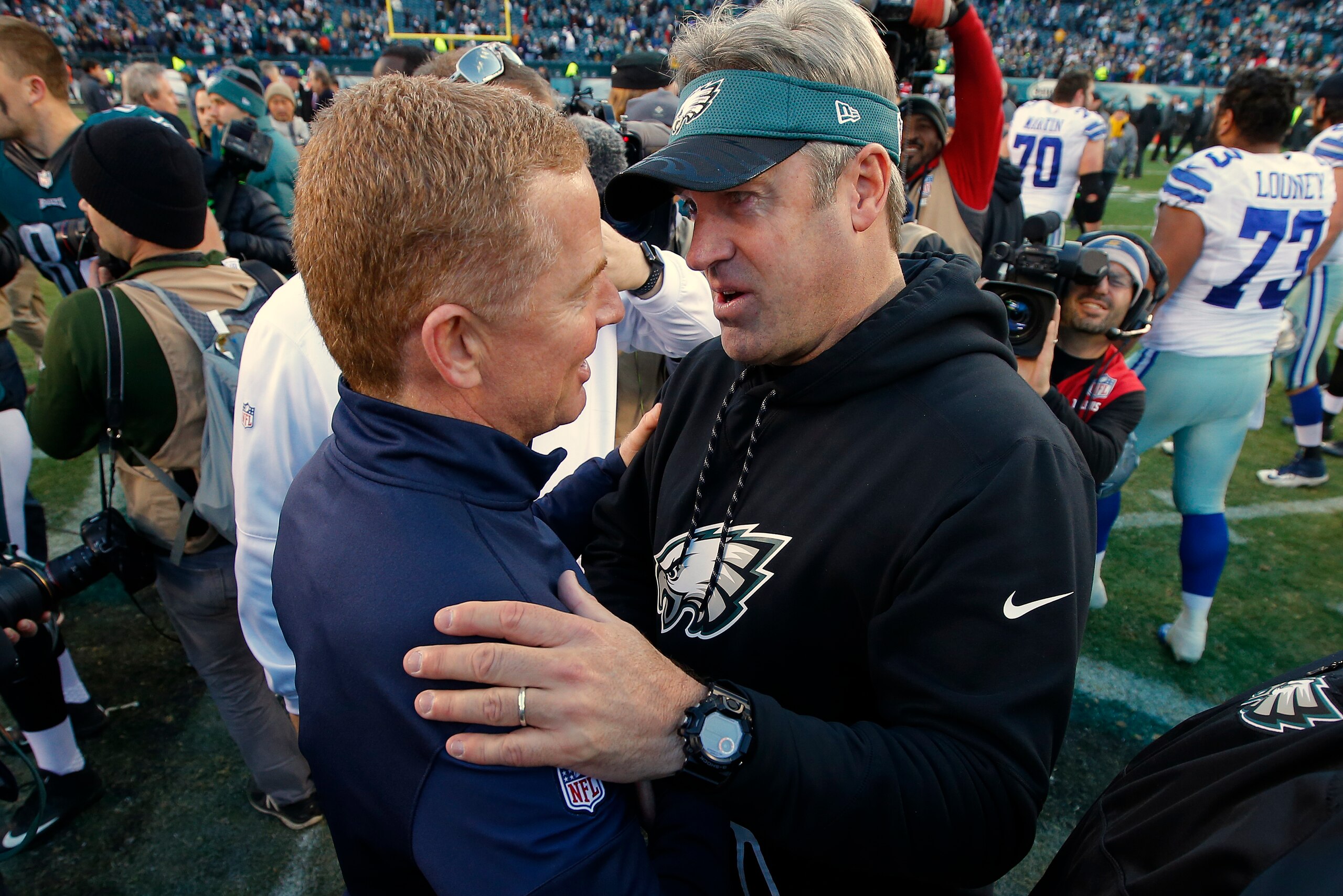 PHILADELPHIA, PA - JANUARY 01: Head coach Jason Garrett of the Dallas Cowboys, left, shakes hands with head coach Doug Pederson of the Philadelphia Eagles after a game at Lincoln Financial Field on January 1, 2017 in Philadelphia, Pennsylvania. The Eagles PHILADELPHIA, PA - JANUARY 01: Head coach Jason Garrett of the Dallas Cowboys, left, shakes hands with head coach Doug Pederson of the Philadelphia Eagles after a game at Lincoln Financial Field on January 1, 2017 in Philadelphia, Pennsylvania. The Eagles