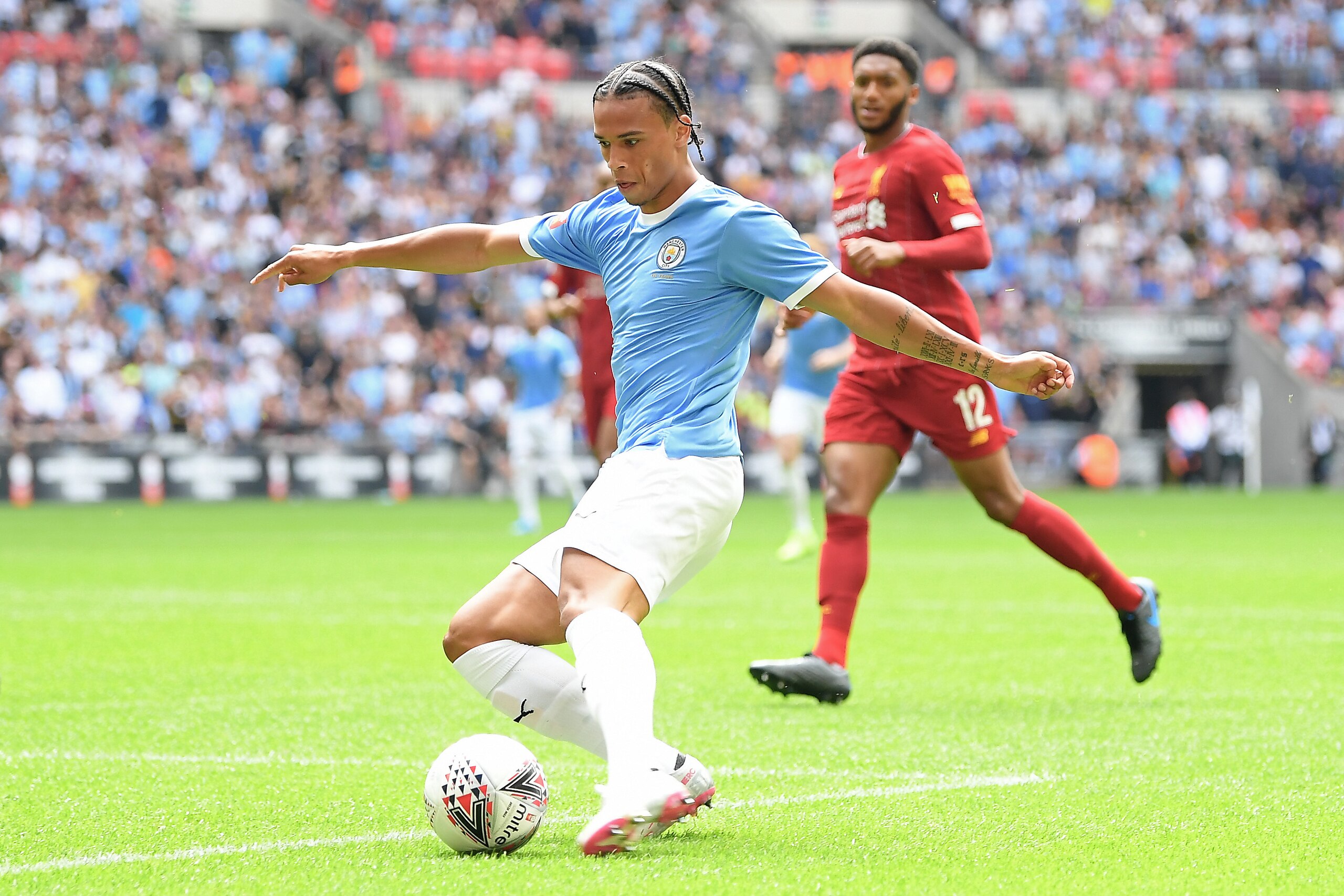 LONDON, ENGLAND - AUGUST 04: Leroy Sane of Manchester City shoots during the FA Community Shield match between Liverpool and Manchester City at Wembley Stadium on August 04, 2019 in London, England. (Photo by Michael Regan/Getty Images) LONDON, ENGLAND - AUGUST 04: Leroy Sane of Manchester City shoots during the FA Community Shield match between Liverpool and Manchester City at Wembley Stadium on August 04, 2019 in London, England. (Photo by Michael Regan/Getty Images)