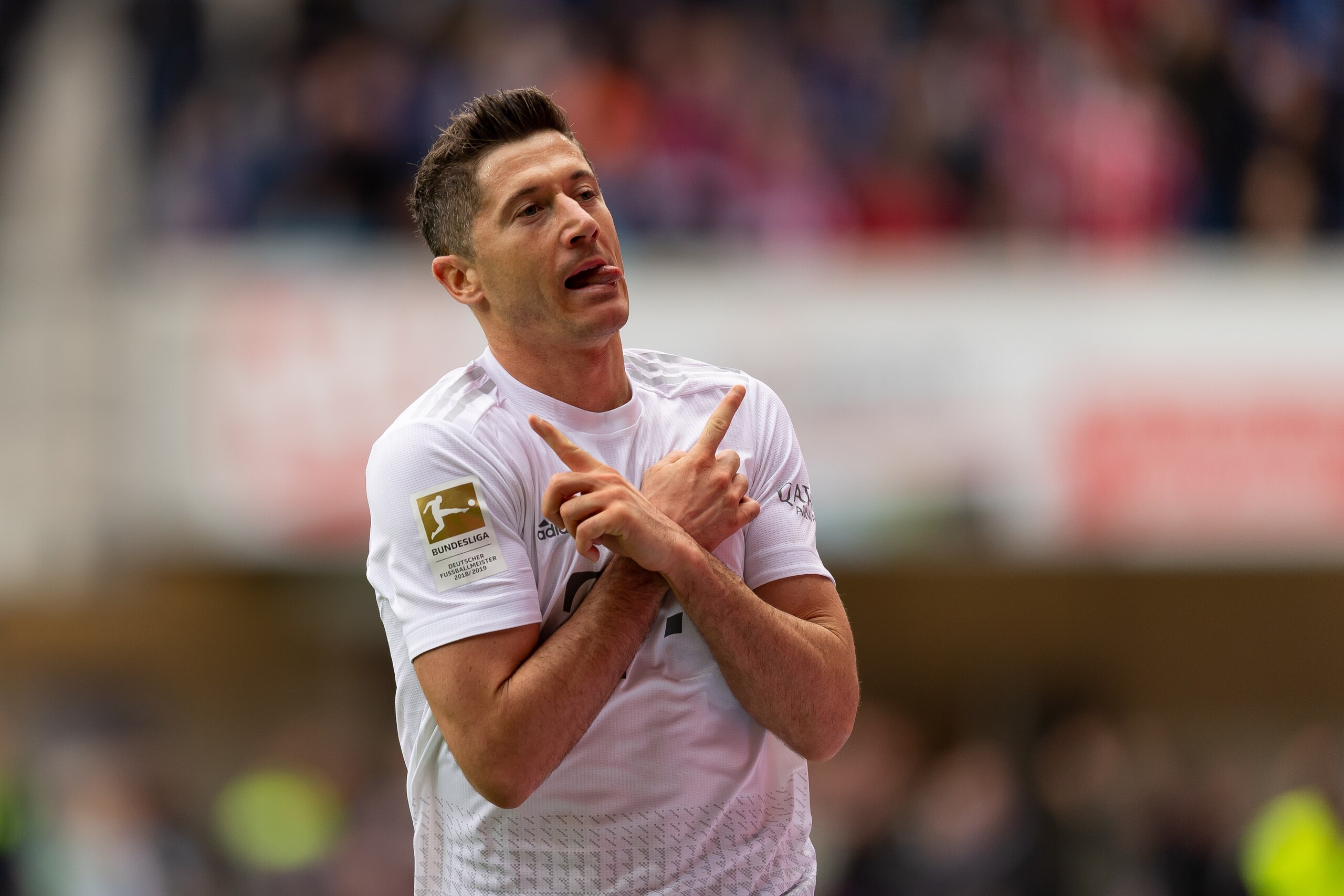 PADERBORN, GERMANY - SEPTEMBER 28: Robert Lewandowski of Bayern Muenchen celebrates after scoring his team's third goal during the Bundesliga match between SC Paderborn 07 and FC Bayern Muenchen at Benteler Arena on September 28, 2019 in Paderborn, German