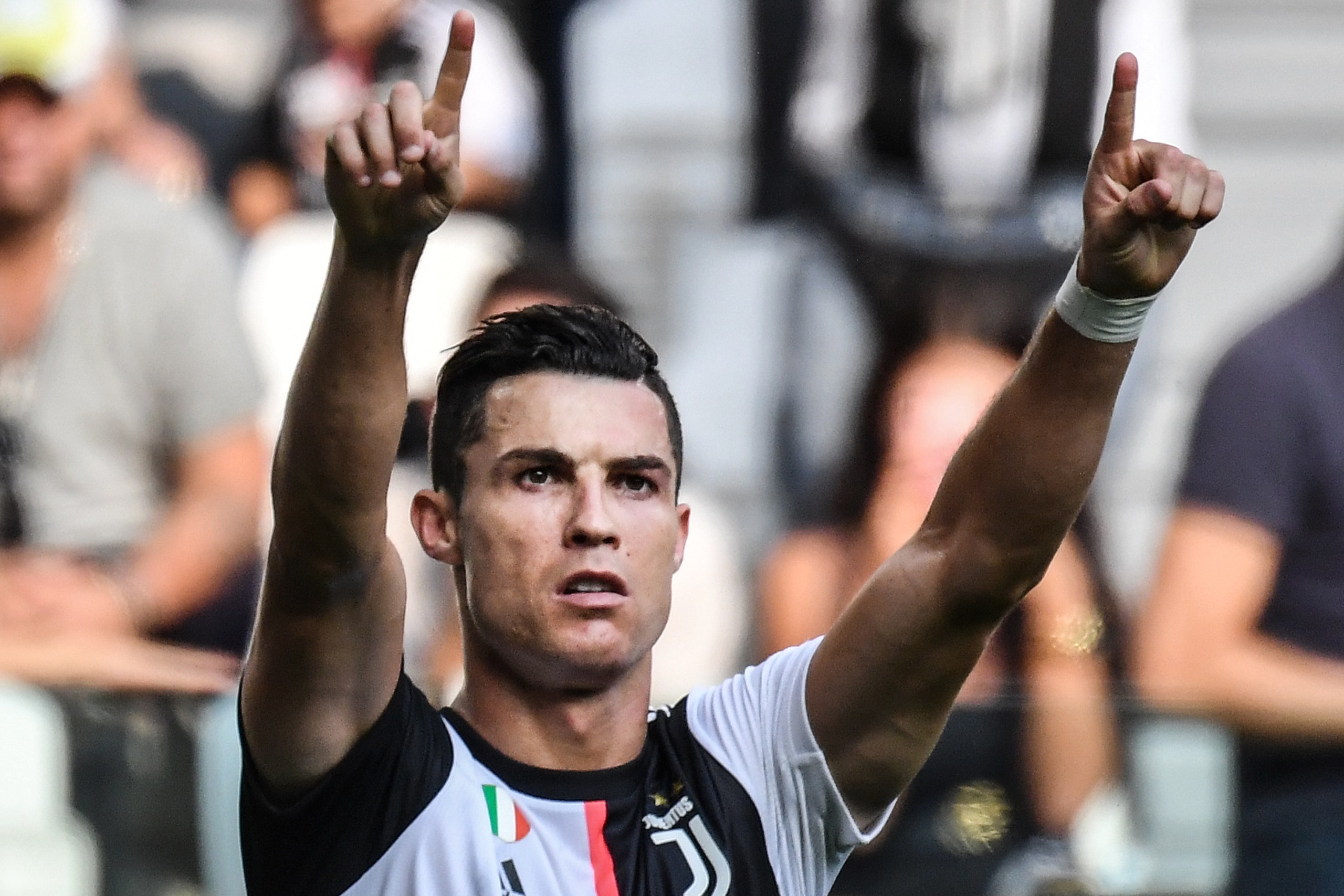 Juventus' Portuguese forward Cristiano Ronaldo celebrates after scoring during the Italian Serie A football match Juventus vs Spal on September 28, 2019 at the Juventus stadium in Turin. (Photo by Andreas SOLARO / AFP)        (Photo credit should read AND