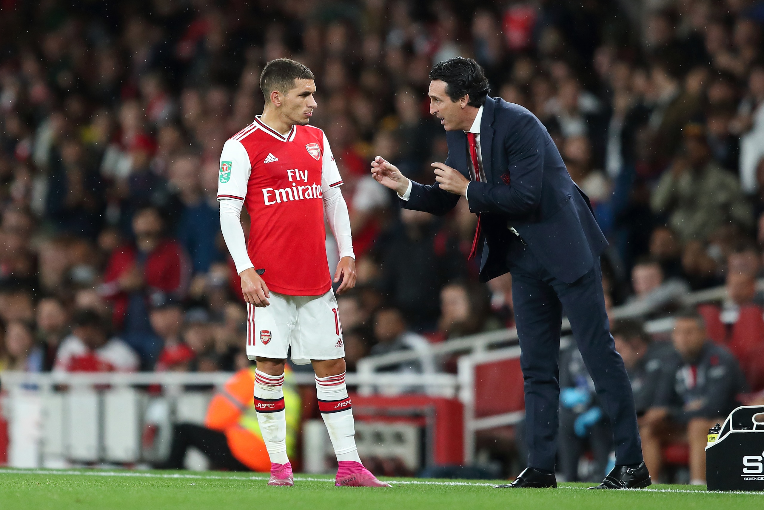 LONDON, ENGLAND - SEPTEMBER 24: Lucas Torreira with Arsenal manager / head coach Unai Emery during the Carabao Cup Third Round match between Arsenal and Nottingham Forest at Emirates Stadium on September 24, 2019 in London, England. (Photo by James Willia