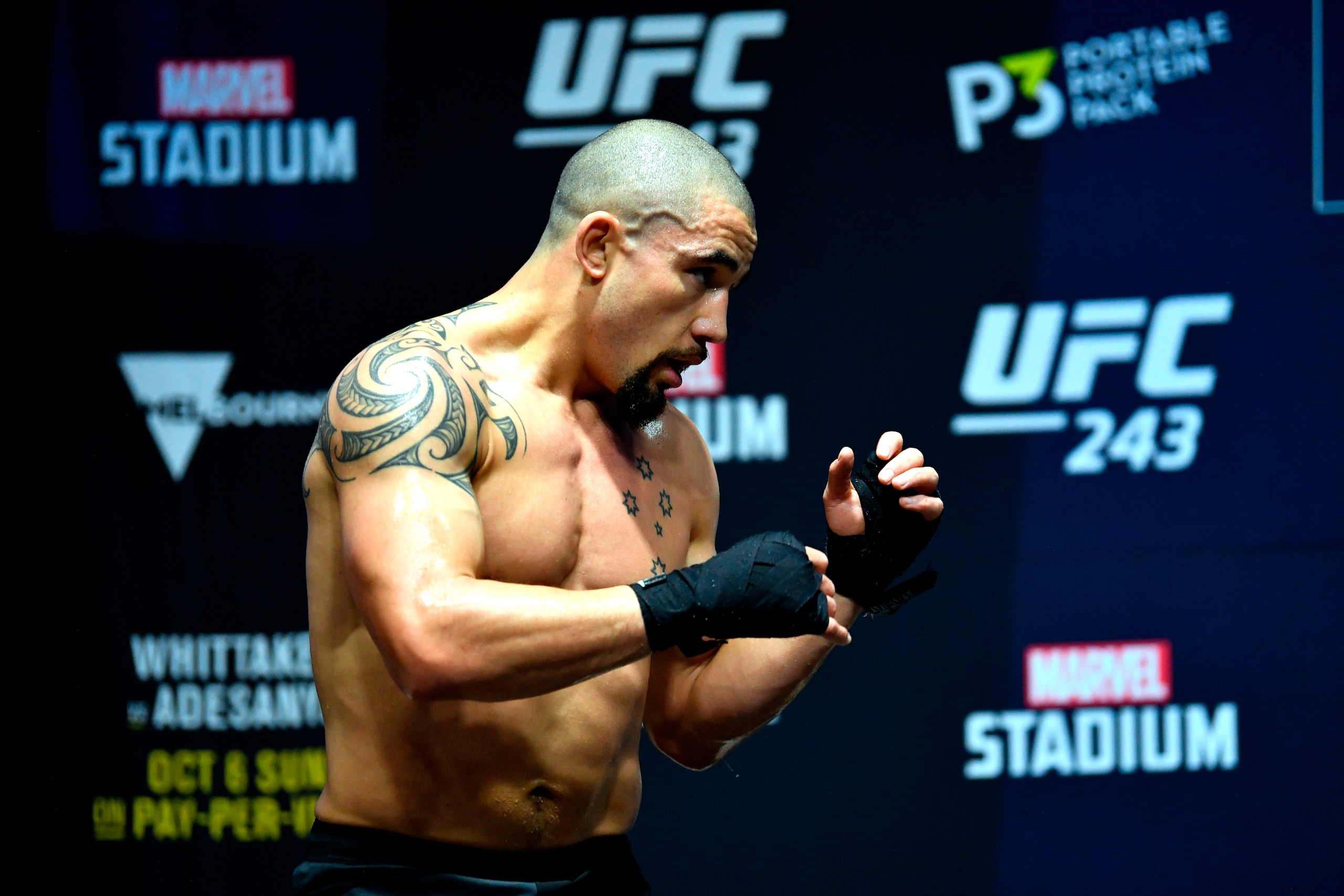 MELBOURNE, AUSTRALIA - OCTOBER 03:  Robert Whittaker of New Zealand holds an open training session for fans and media during UFC 243 open workouts at Federation Square on October 3, 2019 in Melbourne, Australia. (Photo by Jeff Bottari/Zuffa LLC/Zuffa LLC 