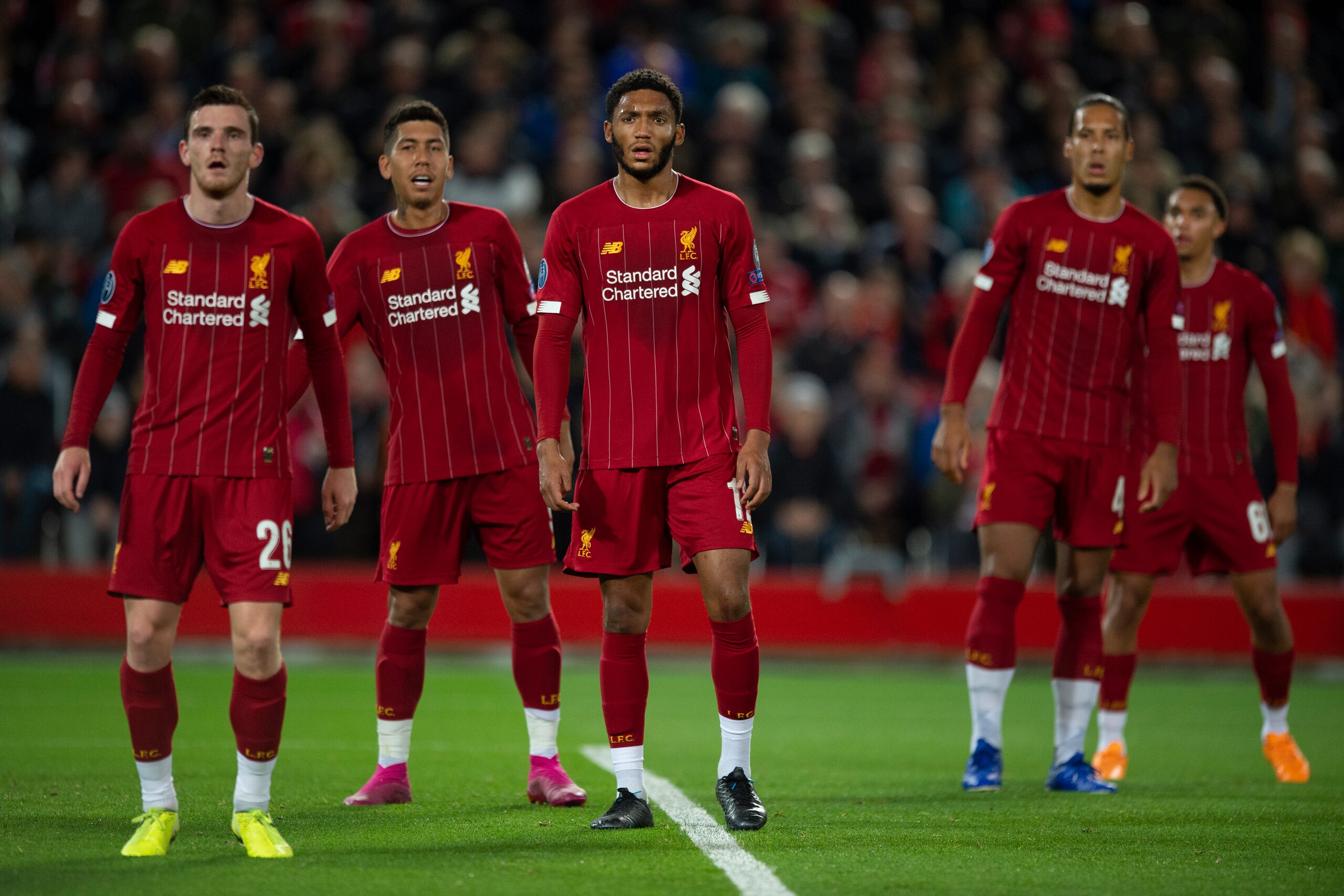 LIVERPOOL, ENGLAND - OCTOBER 02: Liverpool players Andy Robertson, Joe Gomez, Roberto Firmino, Virgil van Dijk and Trent Alexander-Arnold wait for a corner to be taken during the UEFA Champions League group E match between Liverpool FC and RB Salzburg at 
