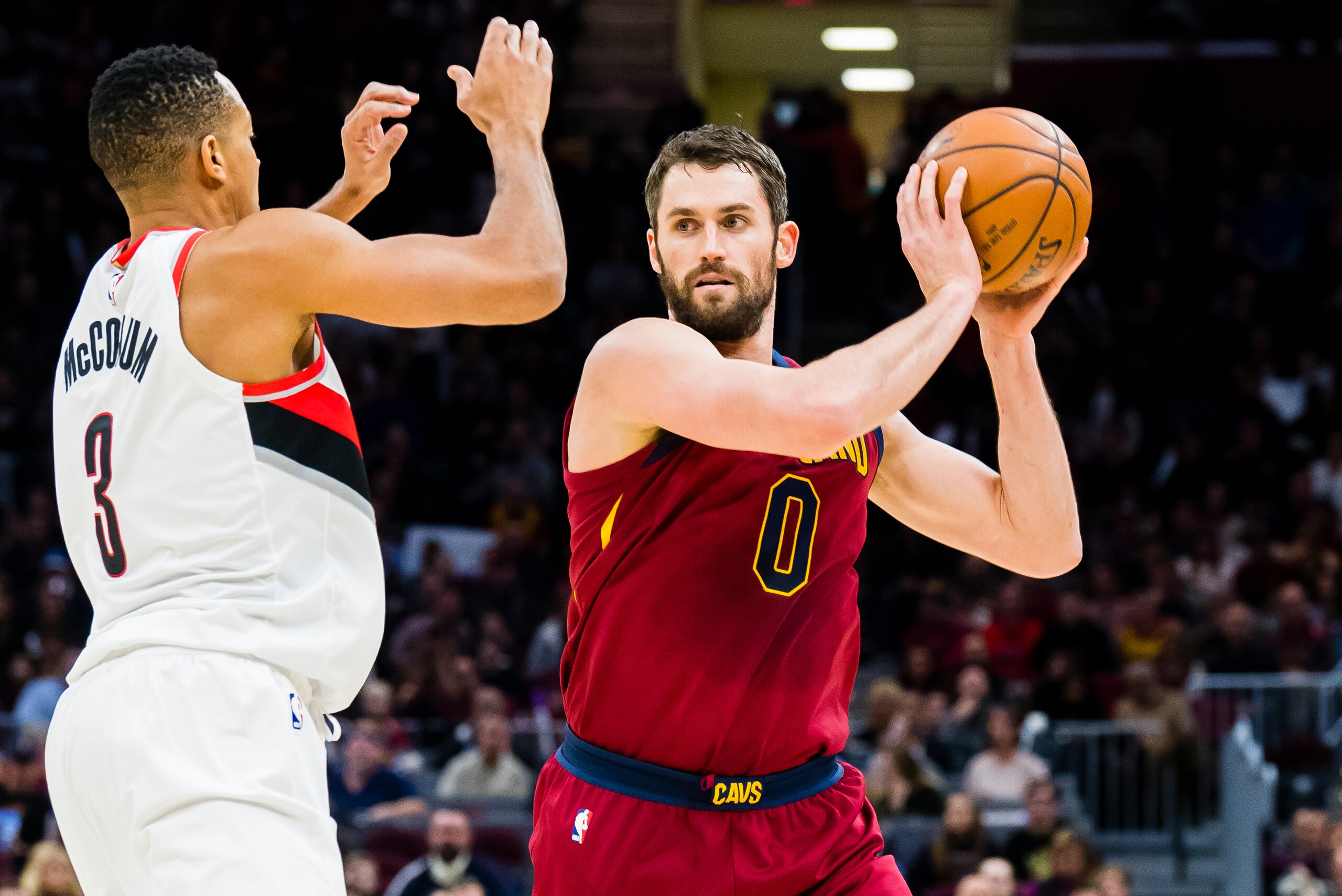 CLEVELAND, OH - JANUARY 2: Kevin Love #0 of the Cleveland Cavaliers looks to pass around Al-Farouq Aminu #8 of the Portland Trail Blazers during the first half at Quicken Loans Arena on January 2, 2018 in Cleveland, Ohio. NOTE TO USER: User expressly ackn