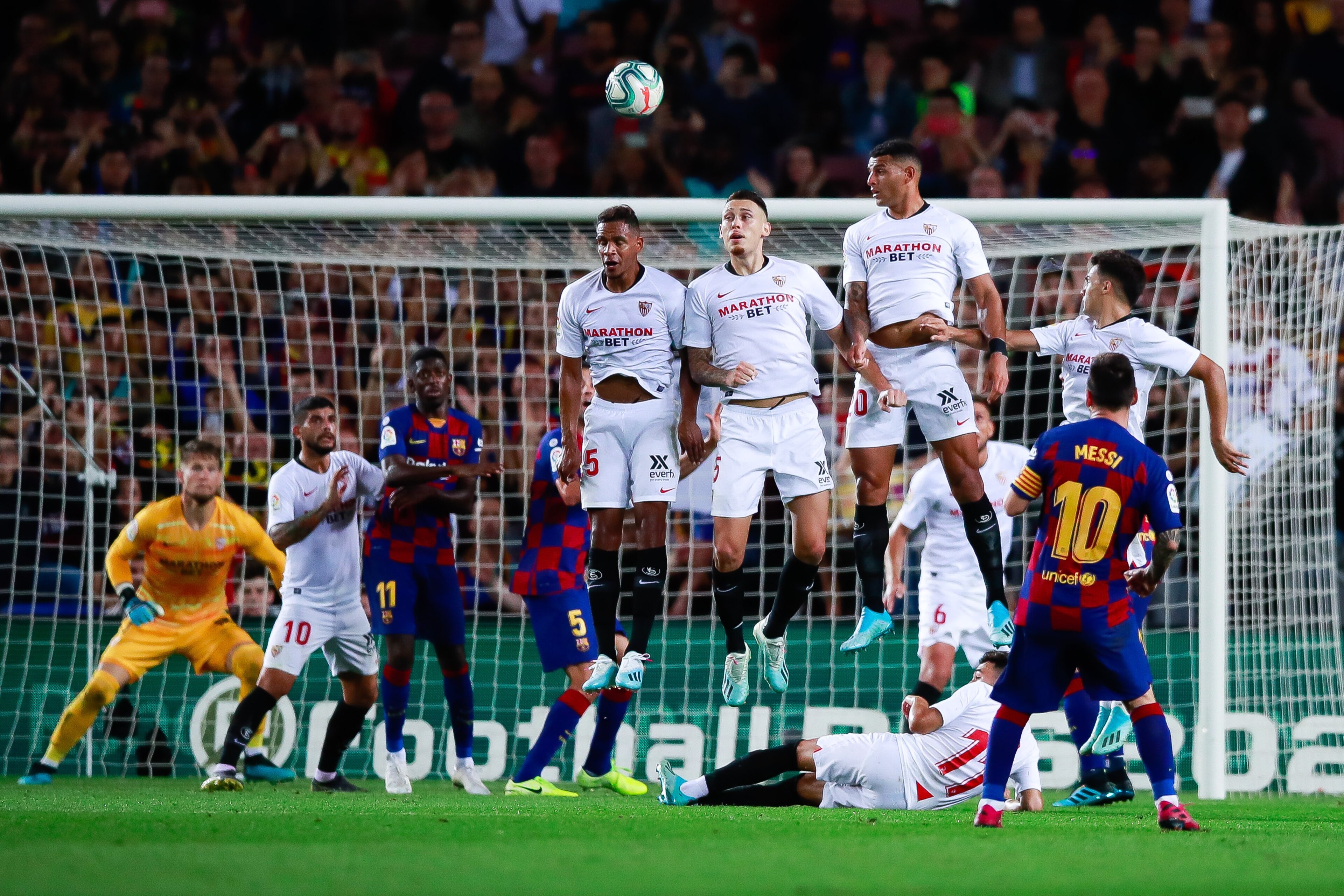 BARCELONA, SPAIN - OCTOBER 06: Lionel Messi of FC Barcelona scores the 4-0 after shoot a free kick during the Liga match between FC Barcelona and Sevilla FC at Camp Nou on October 06, 2019 in Barcelona, Spain. (Photo by Eric Alonso/MB Media/Getty Images)