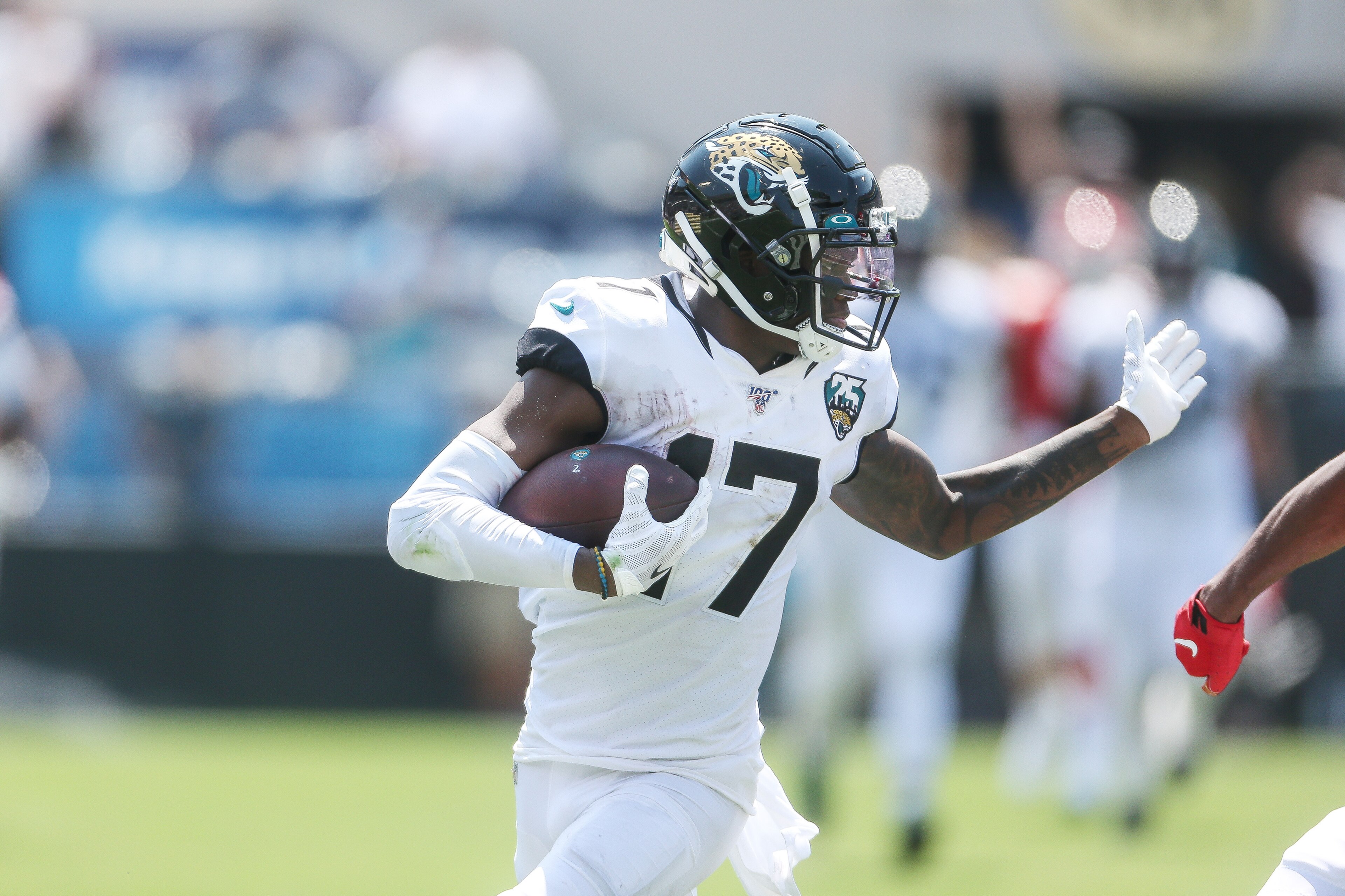 JACKSONVILLE, FLORIDA - SEPTEMBER 08:   
DJ Chark Jr. of the Jacksonville Jaguars carries the ball after catching a pass during a NFL game against the Kansas City Chiefs at TIAA Bank Field on September 08, 2019 in Jacksonville, Florida.  (Photo by John Ca