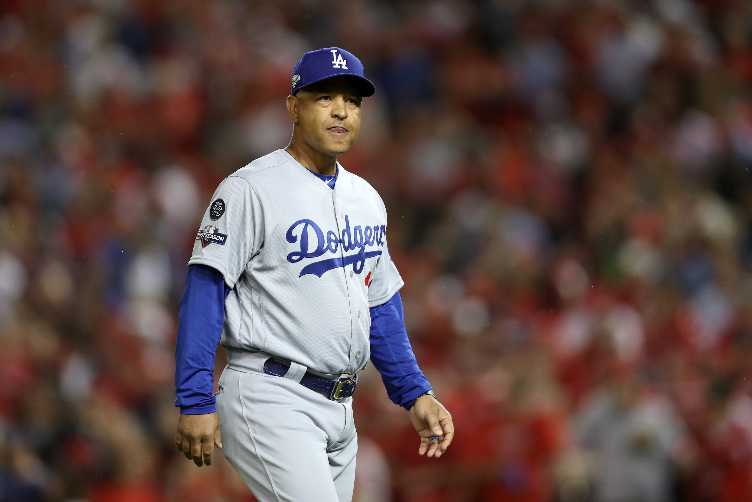 WASHINGTON, DC - OCTOBER 07: Manager Dave Roberts walks to the mound during a pitching change in the fifth inning of game four of the National League Division Series against the Washington Nationals at Nationals Park on October 07, 2019 in Washington, DC.