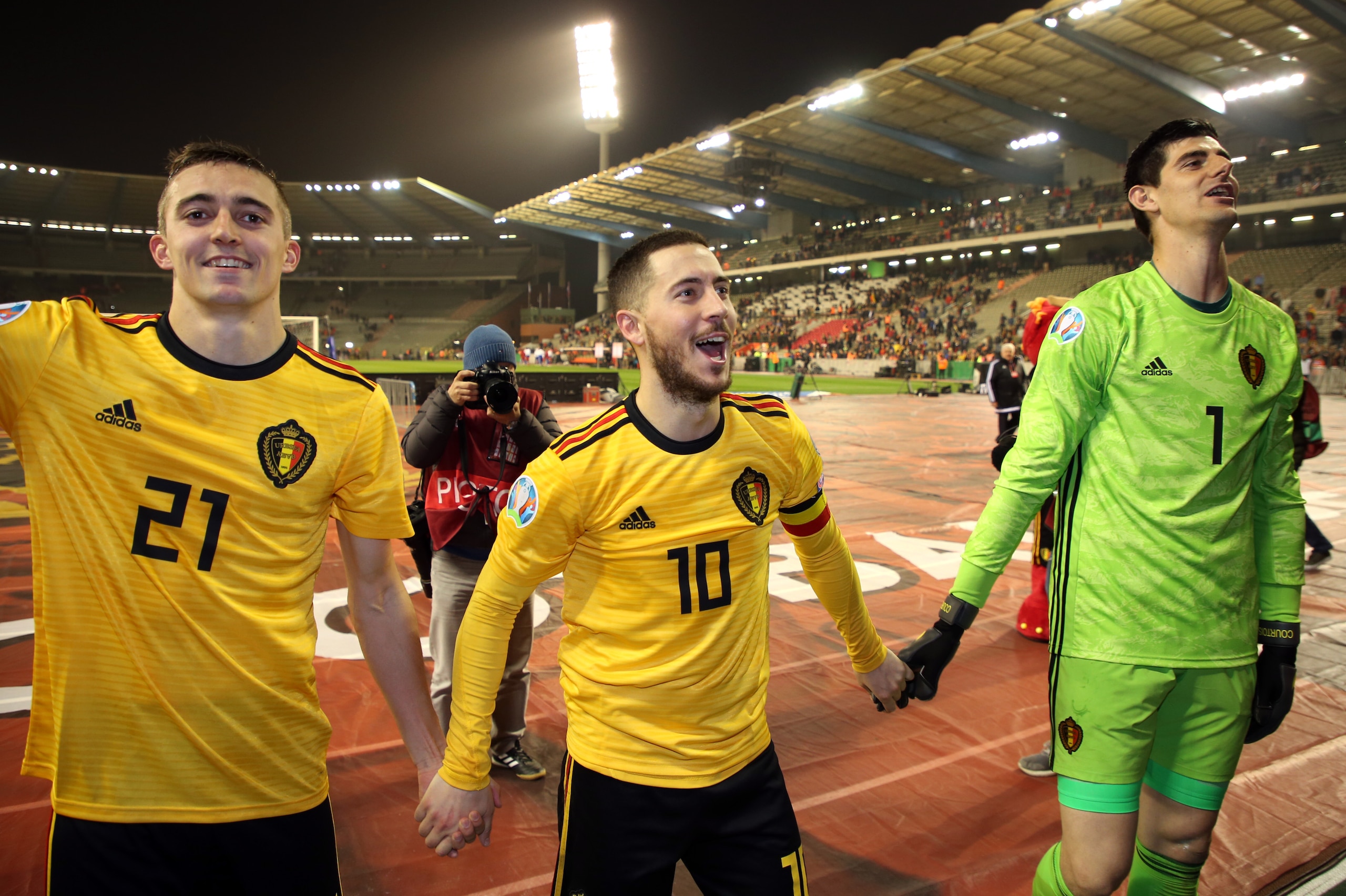 BRUSSELS, BELGIUM - MARCH 21: Timothy Castagne of Belgium, Eden Hazard of Belgium and Thibaut Courtois of Belgium celebrate after winning the 2020 UEFA European Championships group I qualifying match between Belgium and Russia at King Baudouin Stadium on 